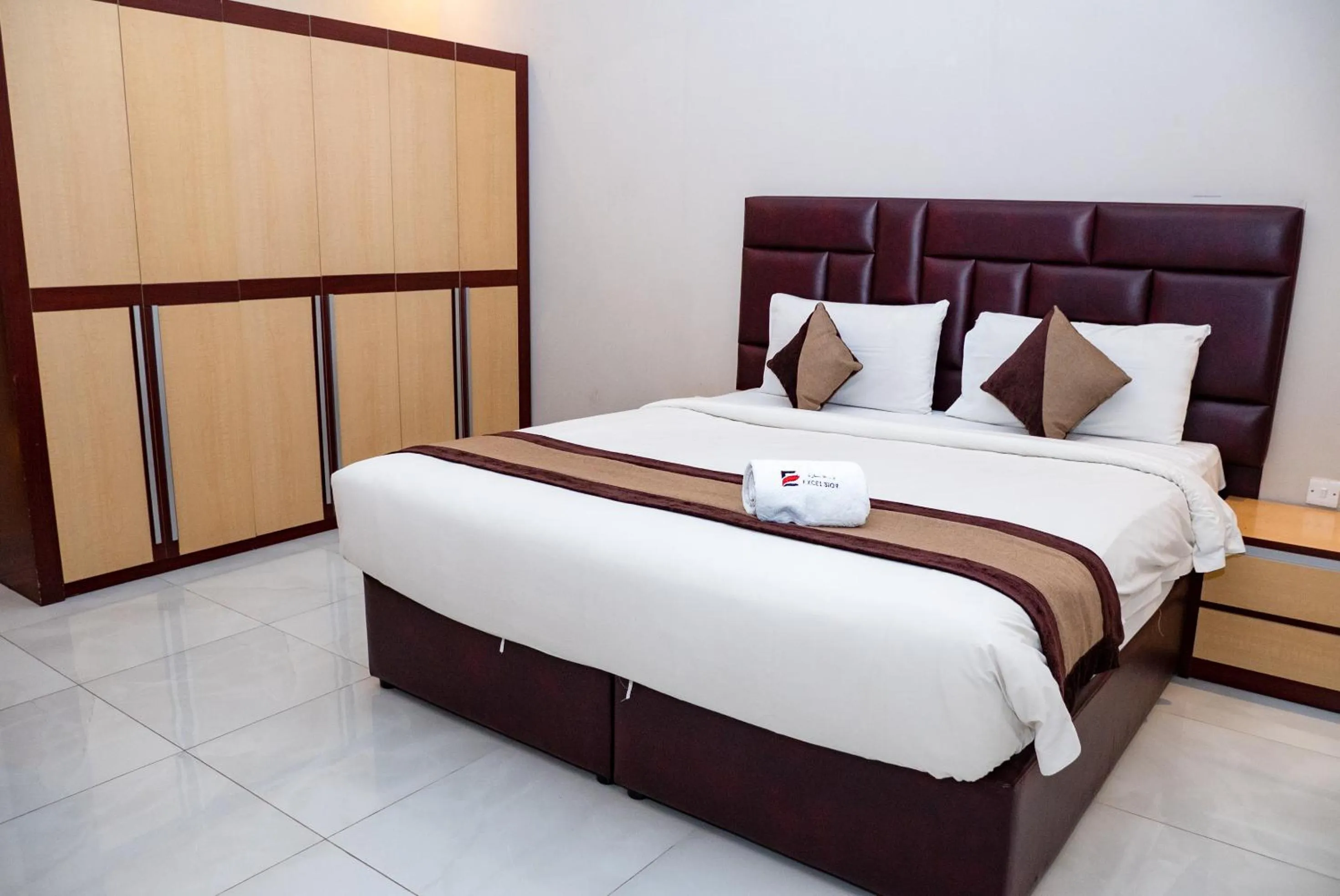 Bed in Excelsior Luxury Apartments