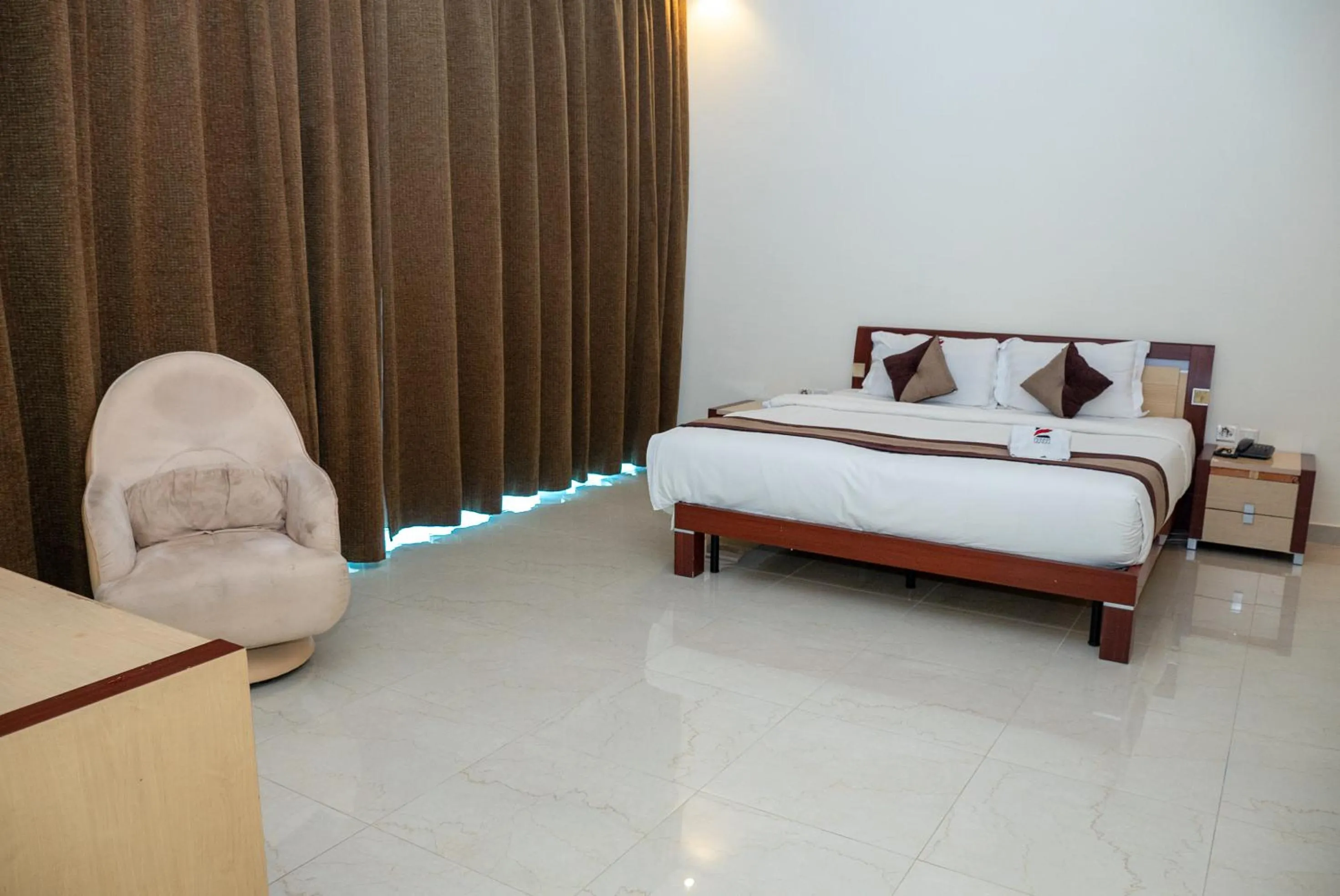 Bed in Excelsior Luxury Apartments