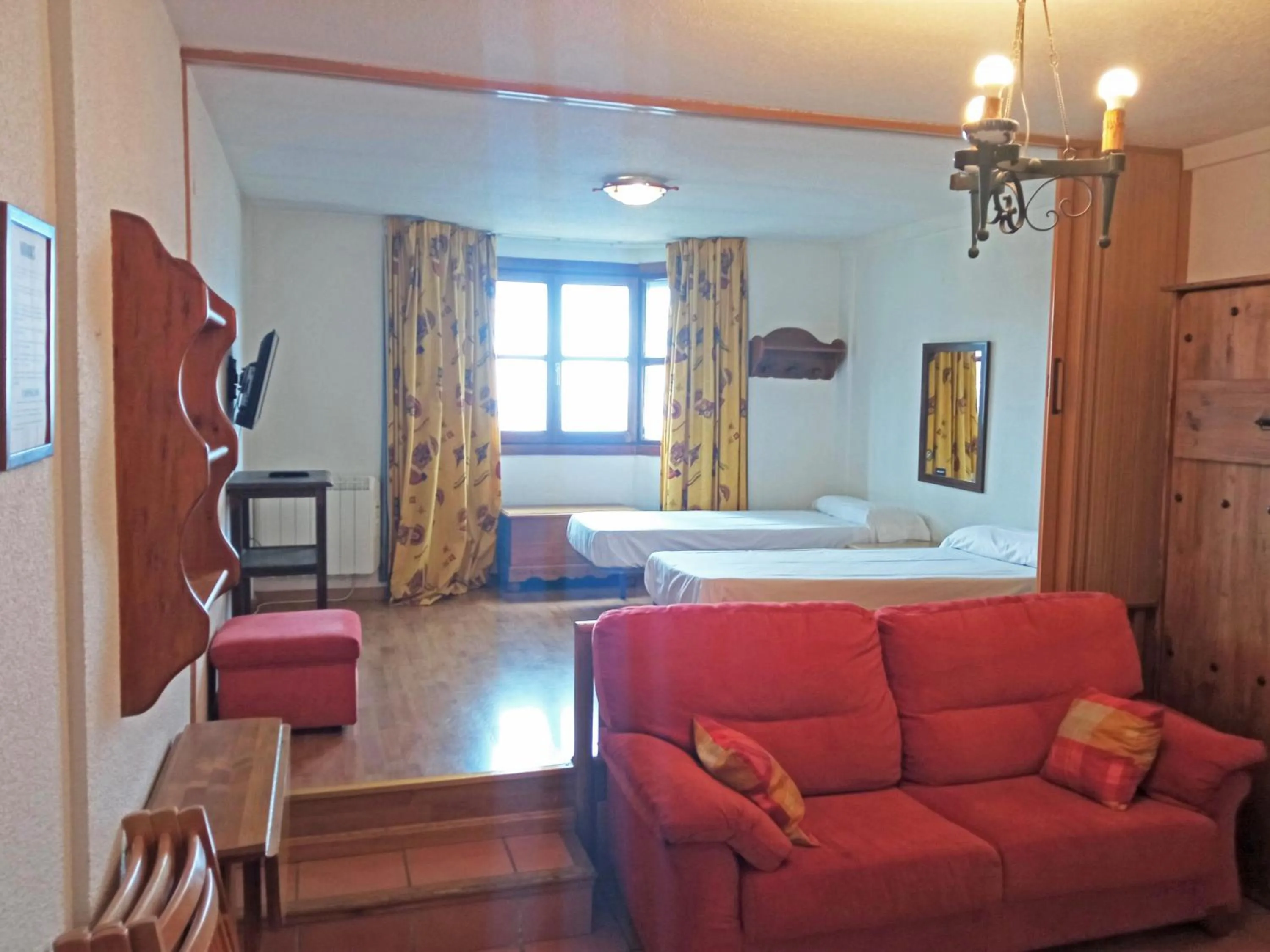 Living room, Bed in Apartamentos Sierra Nevada 3000