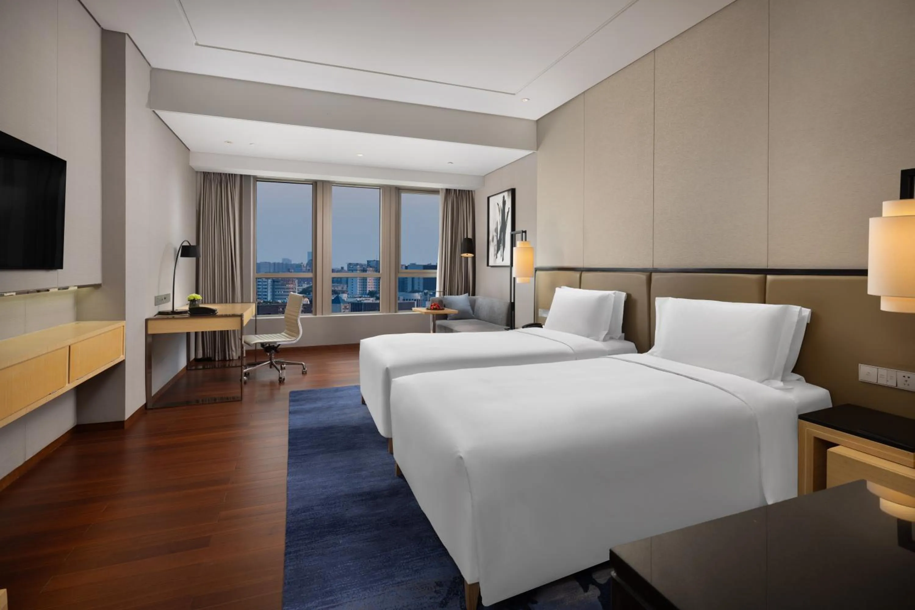 Bed in New World Beijing Hotel