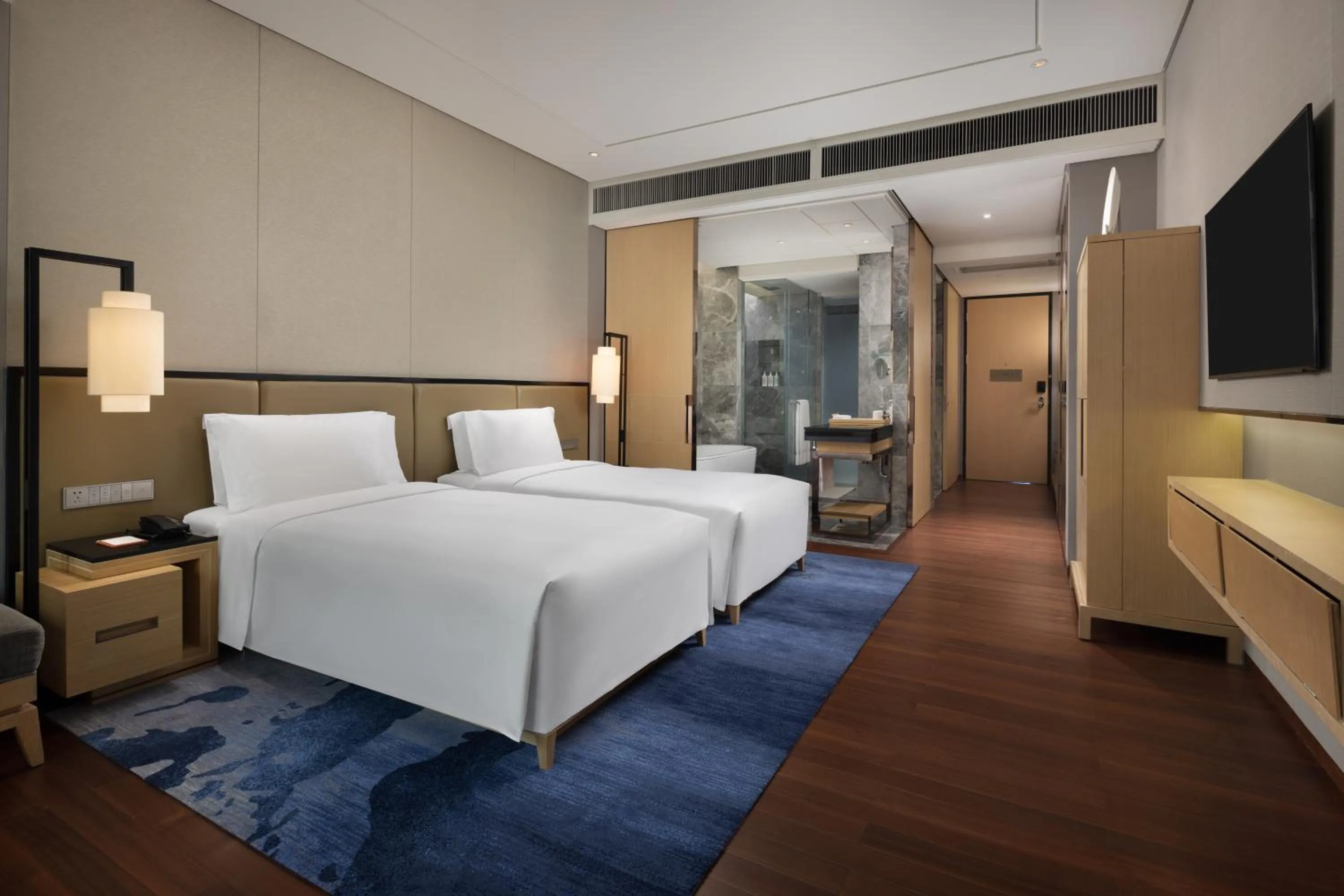 Bed in New World Beijing Hotel