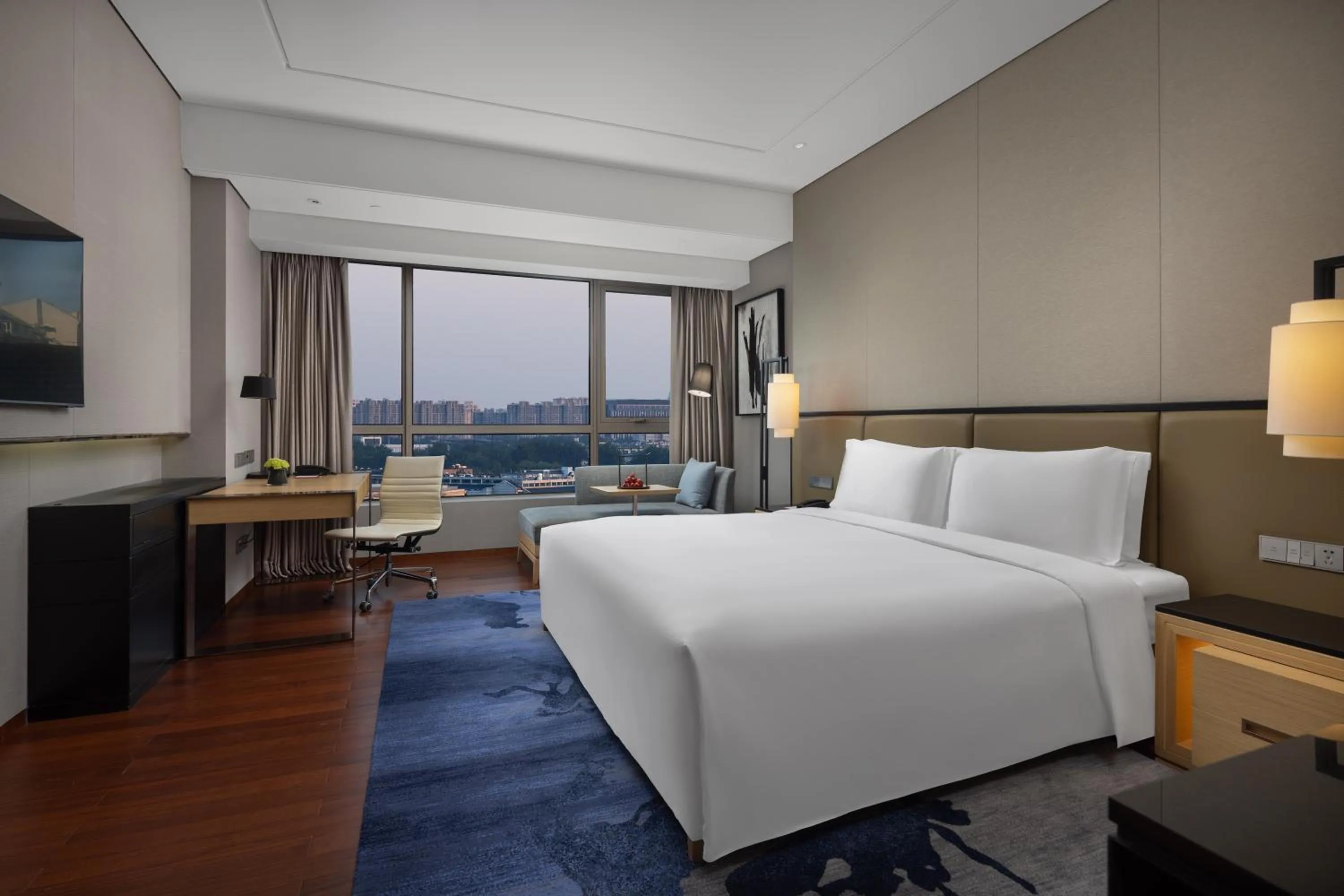 Bed in New World Beijing Hotel