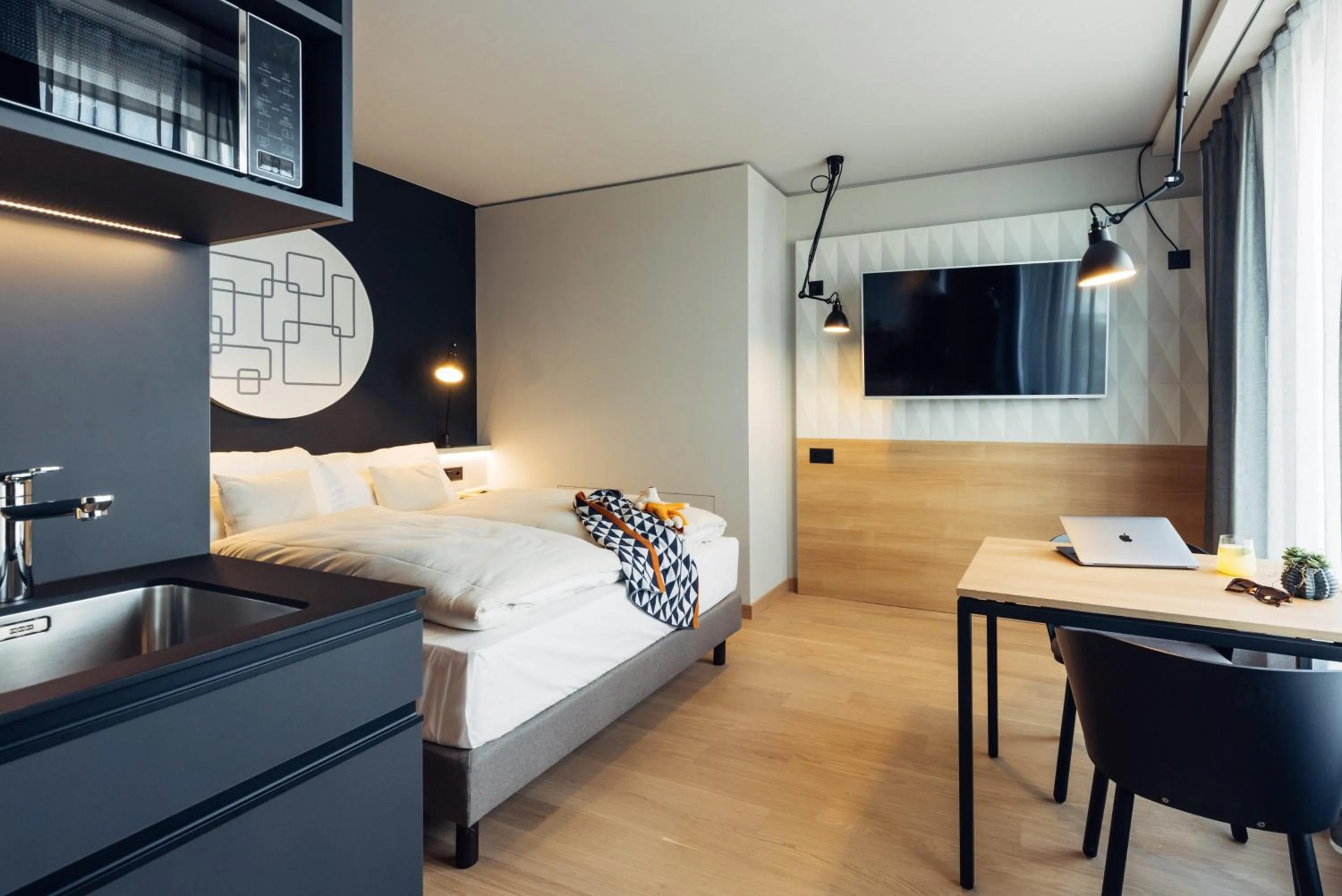 Photo of the whole room, Bed in harry's home Bern-Expo