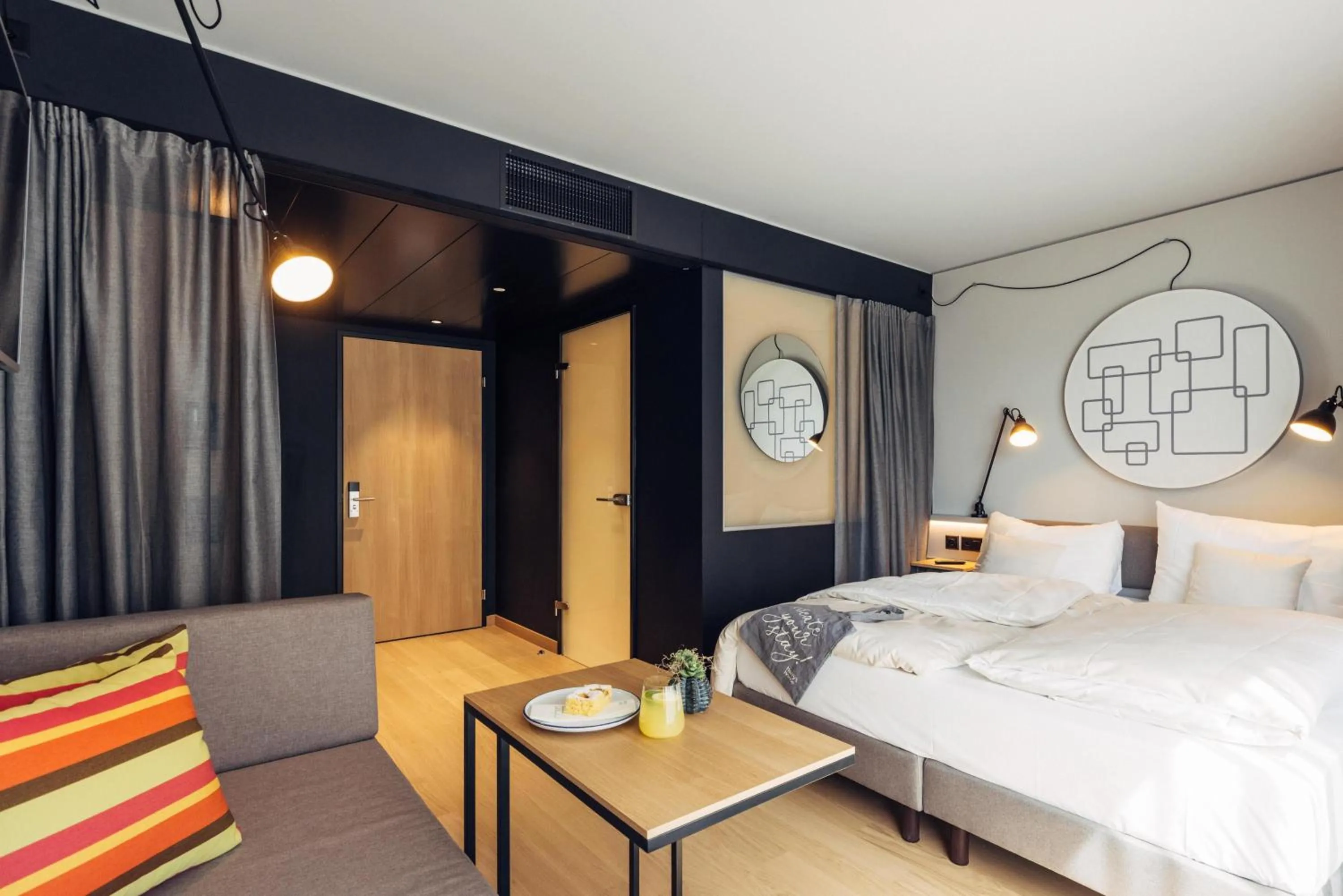 Photo of the whole room, Bed in harry's home Bern-Expo