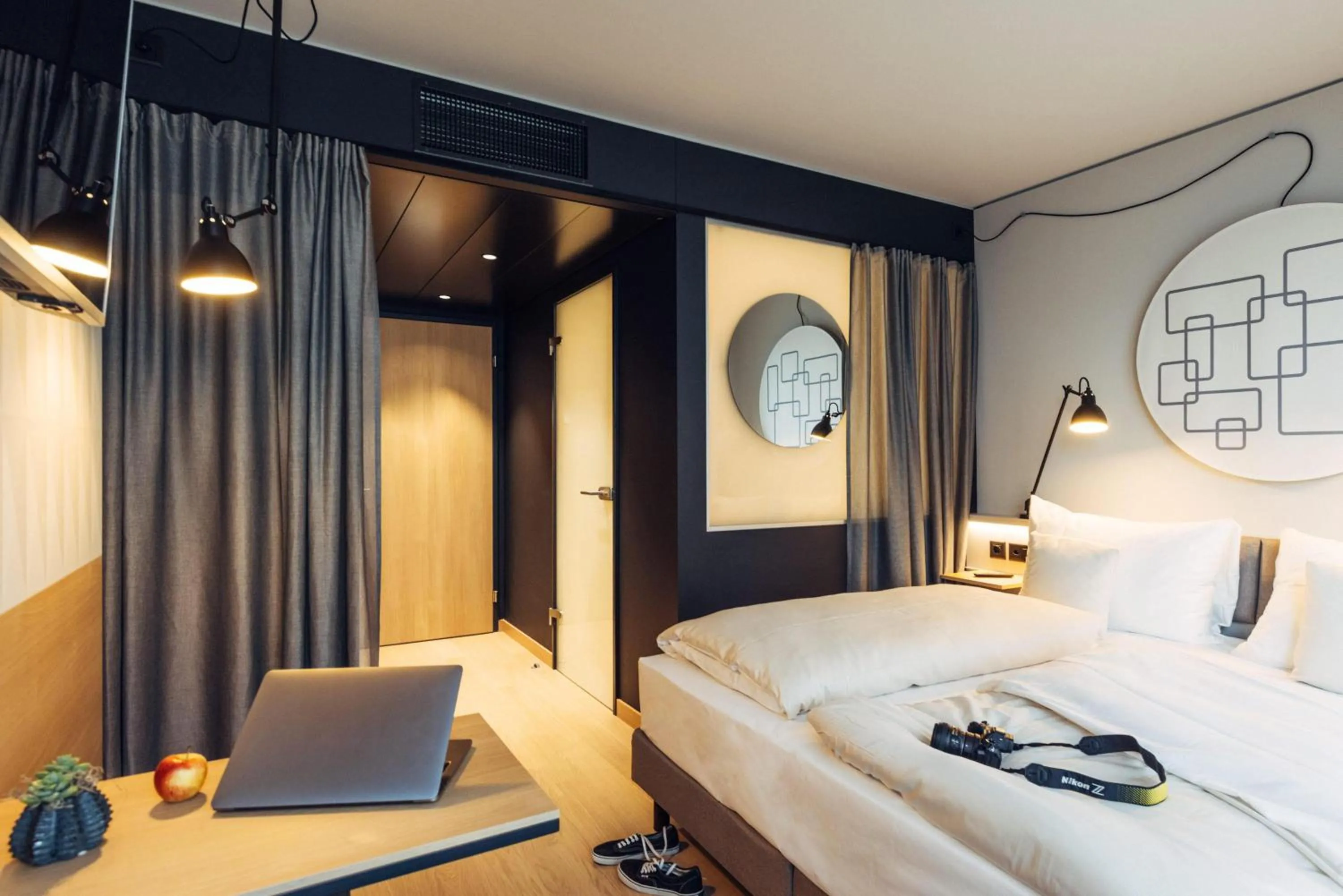 Photo of the whole room, Bed in harry's home Bern-Expo