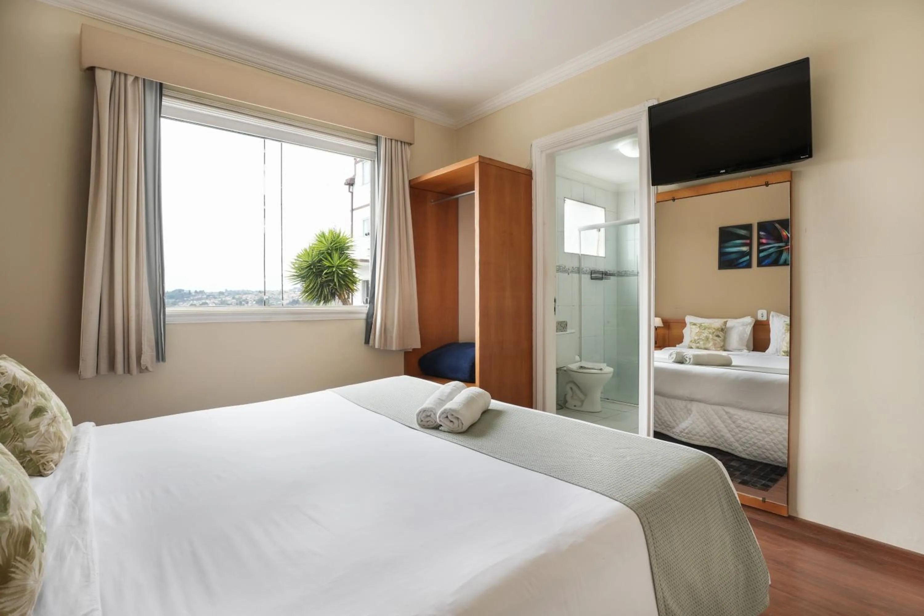 Bed in Pousada Parque das Flores