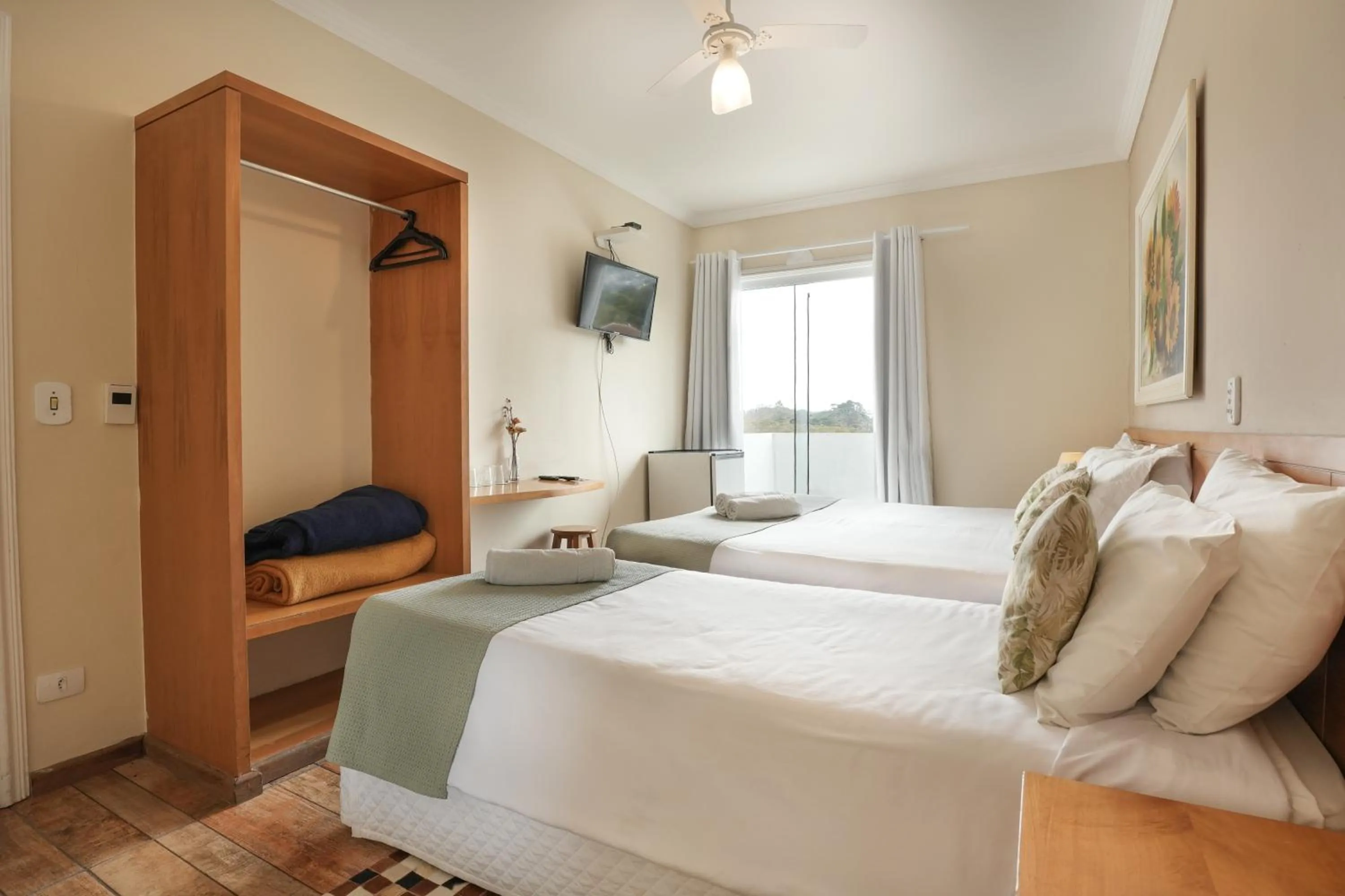 Bed in Pousada Parque das Flores