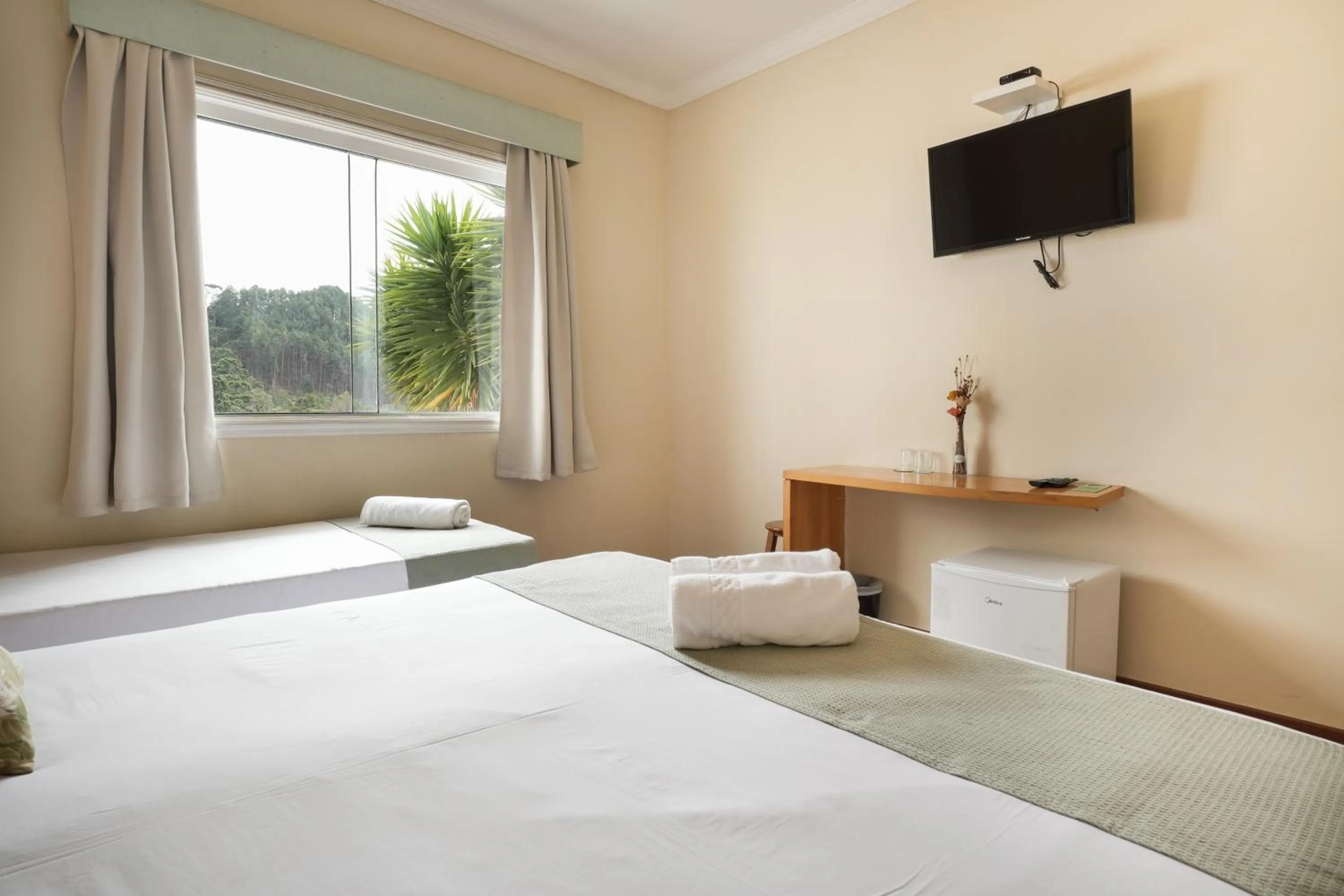 Bed in Pousada Parque das Flores