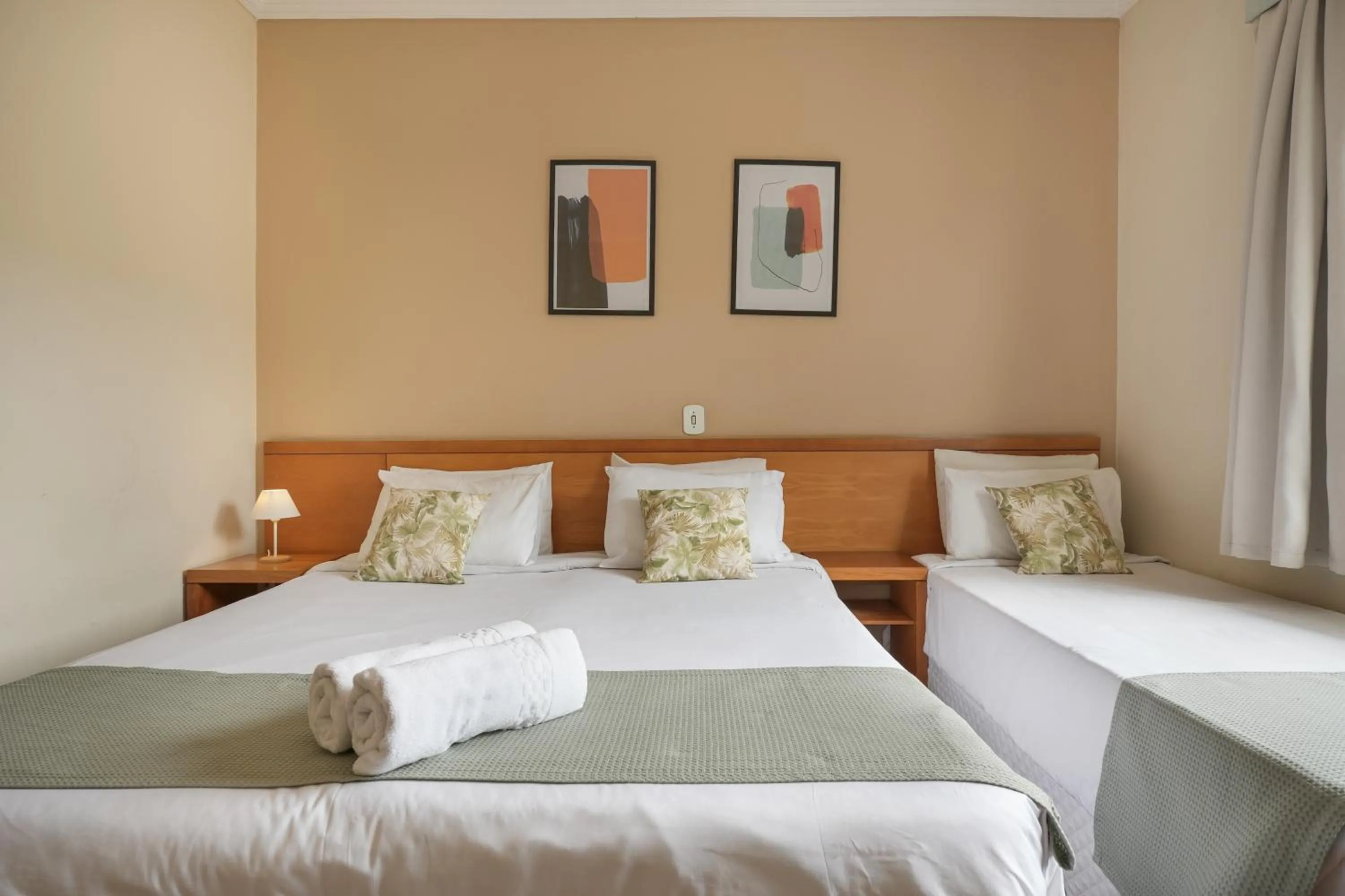 Bed in Pousada Parque das Flores