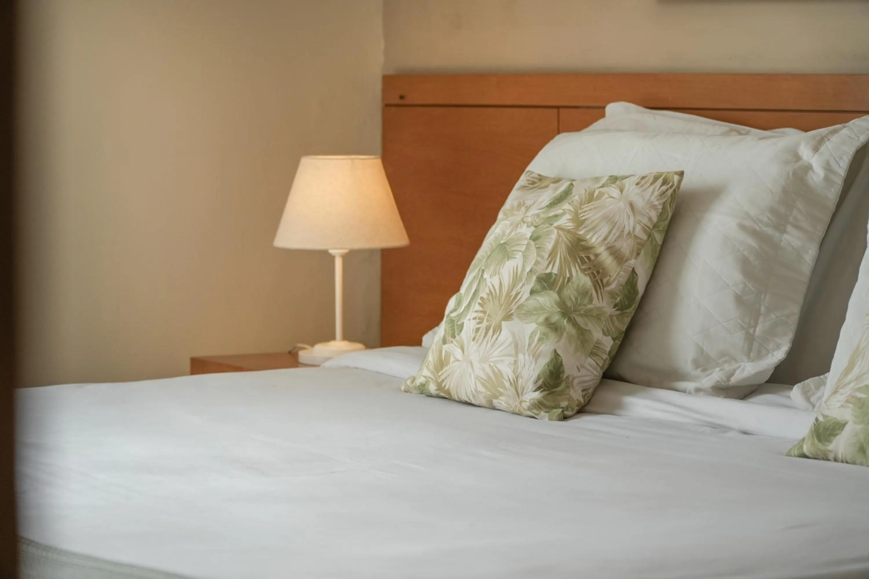 Bed in Pousada Parque das Flores