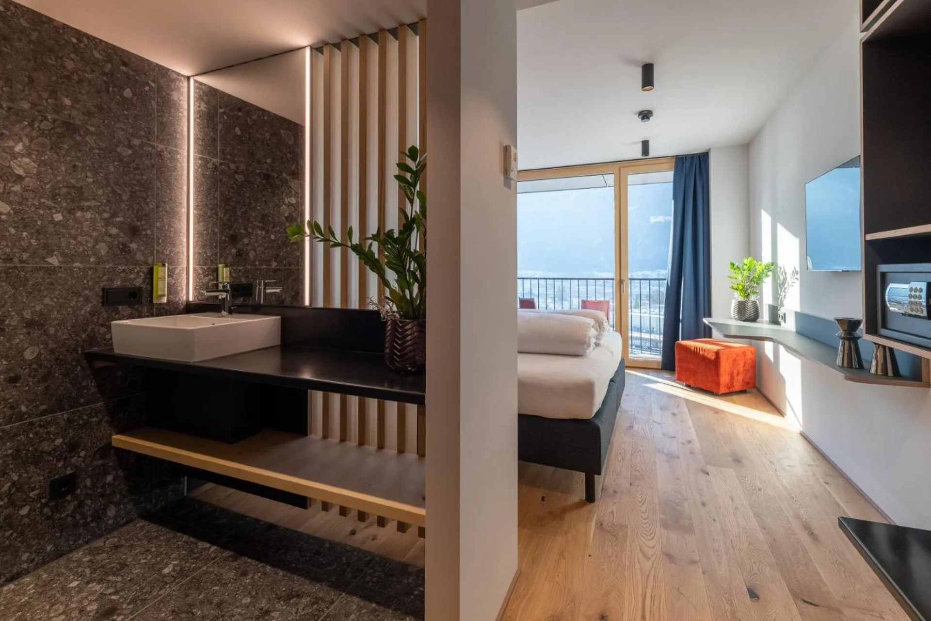 Bed in ALPSTADT LIFESTYLE Hotel