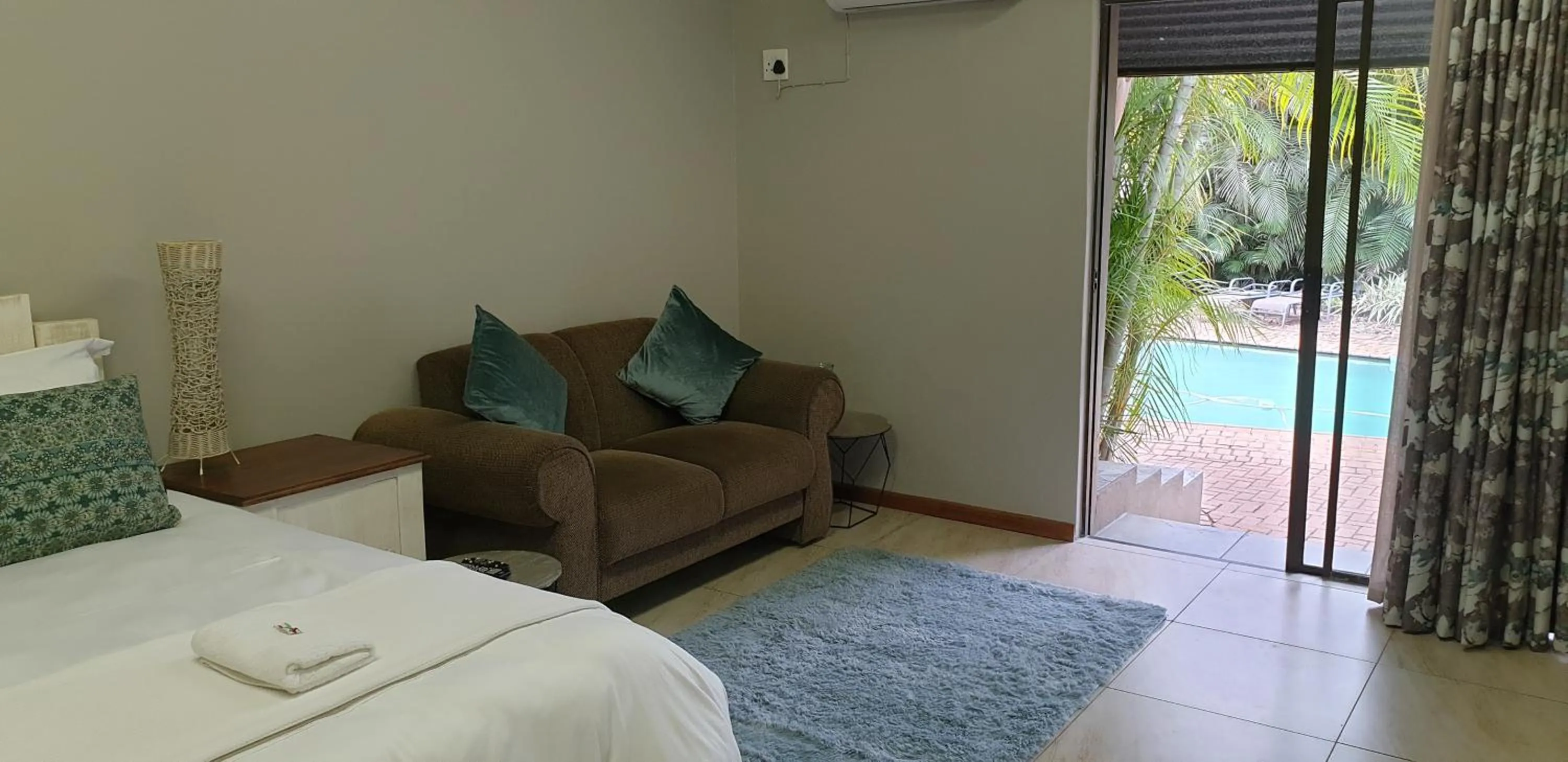 Seating area, Bed in Stoep Cafe Guest House