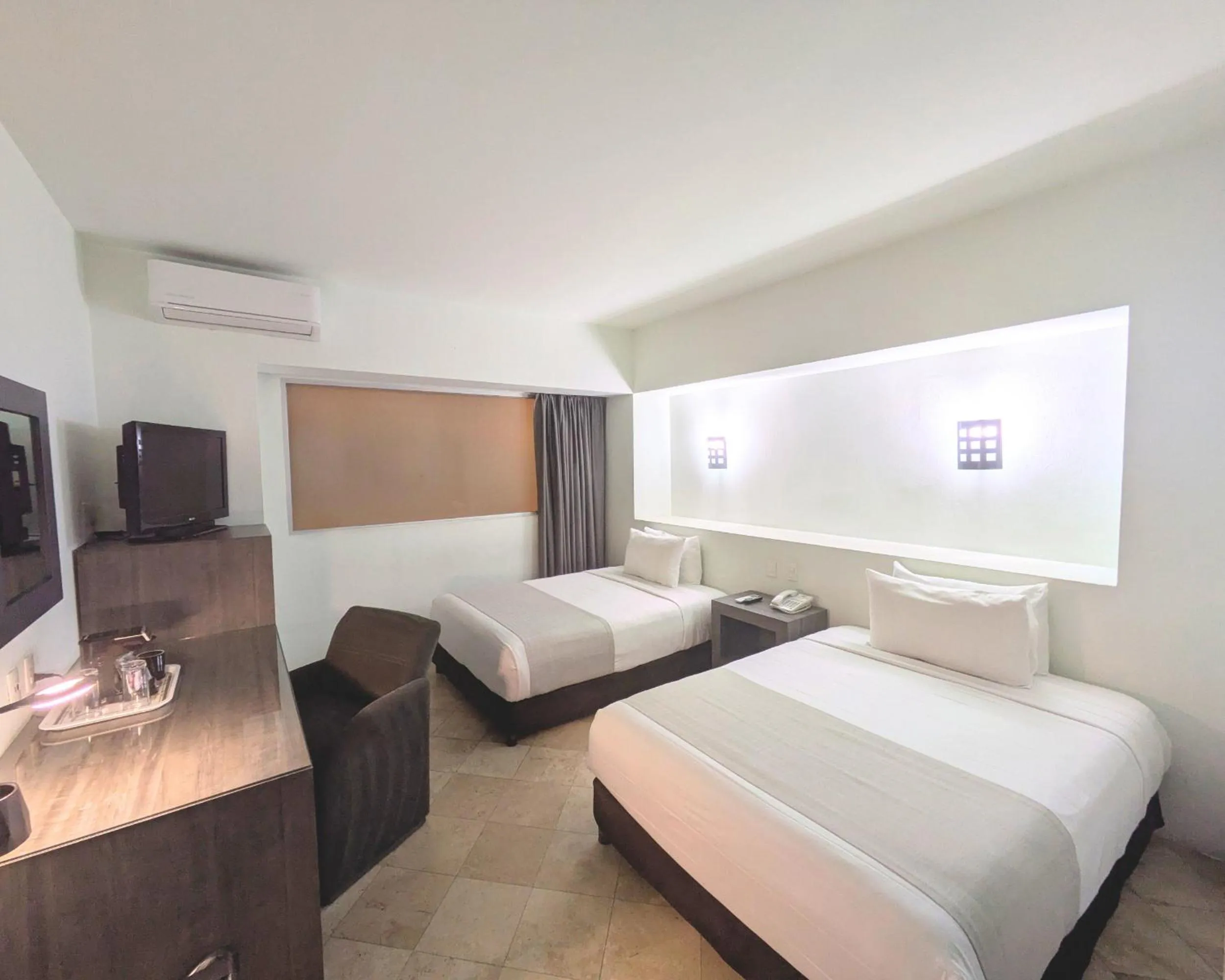 Bed in We Hotel Aeropuerto