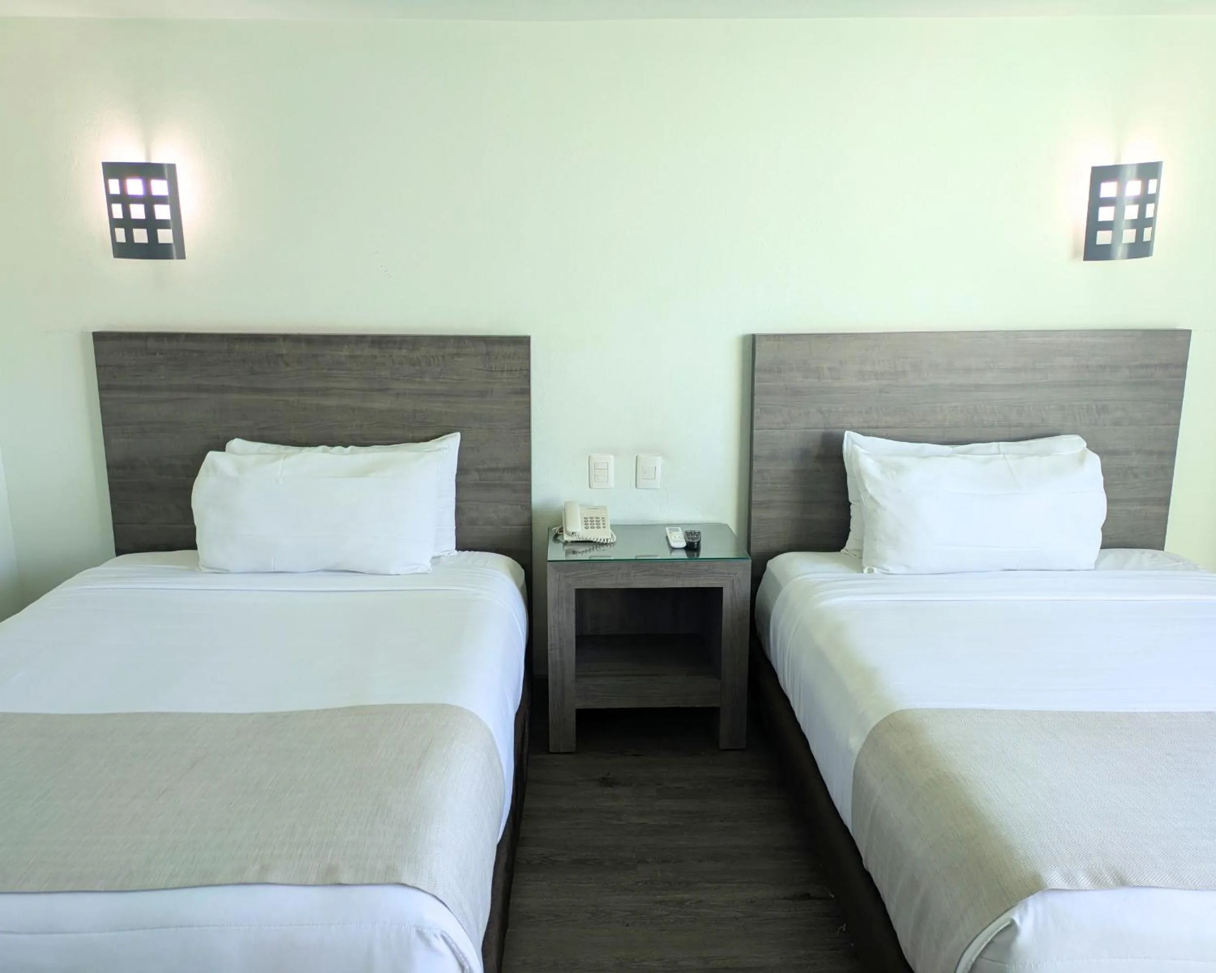 Bed in We Hotel Aeropuerto