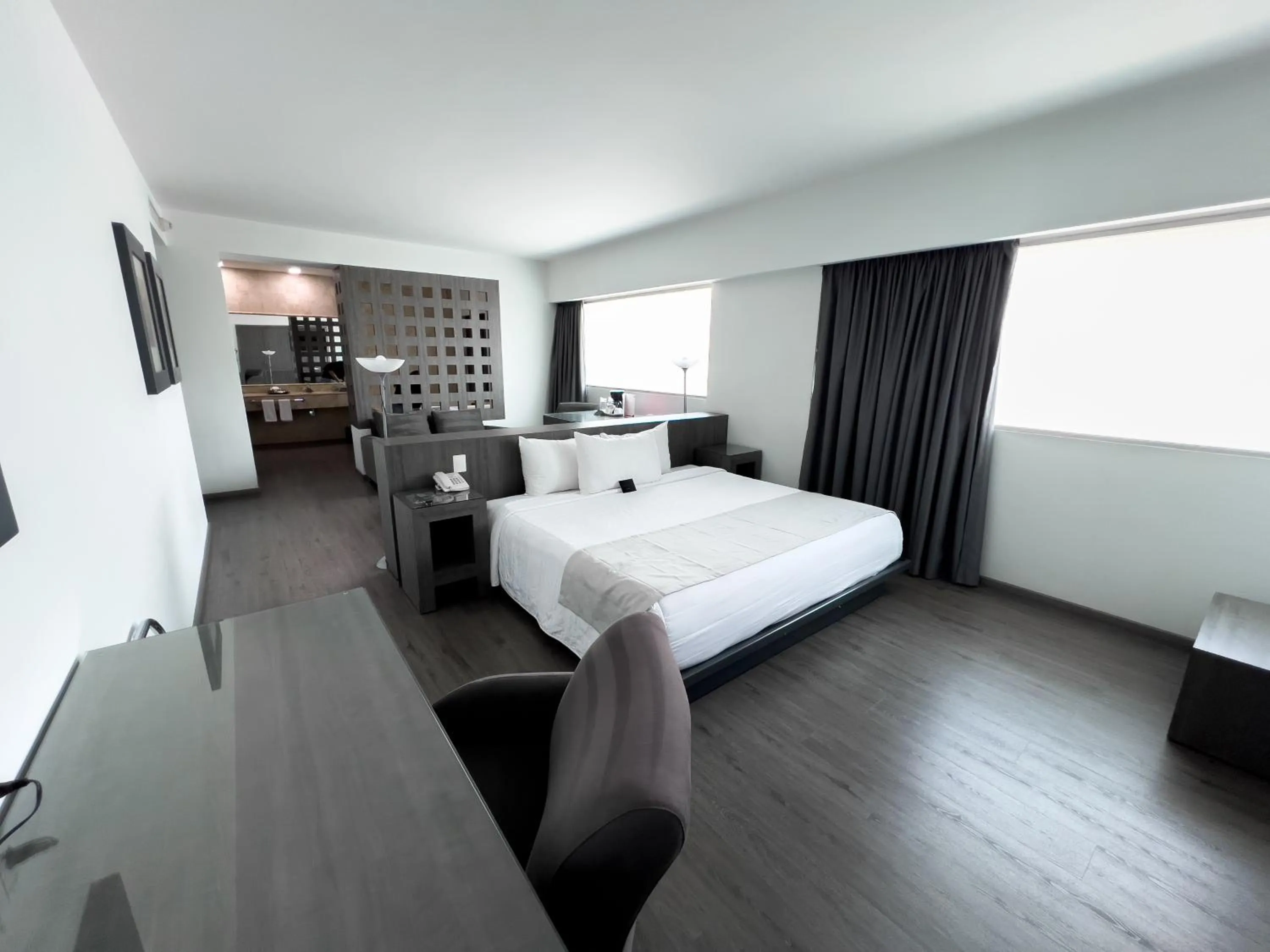 Communal lounge/ TV room, Bed in We Hotel Aeropuerto