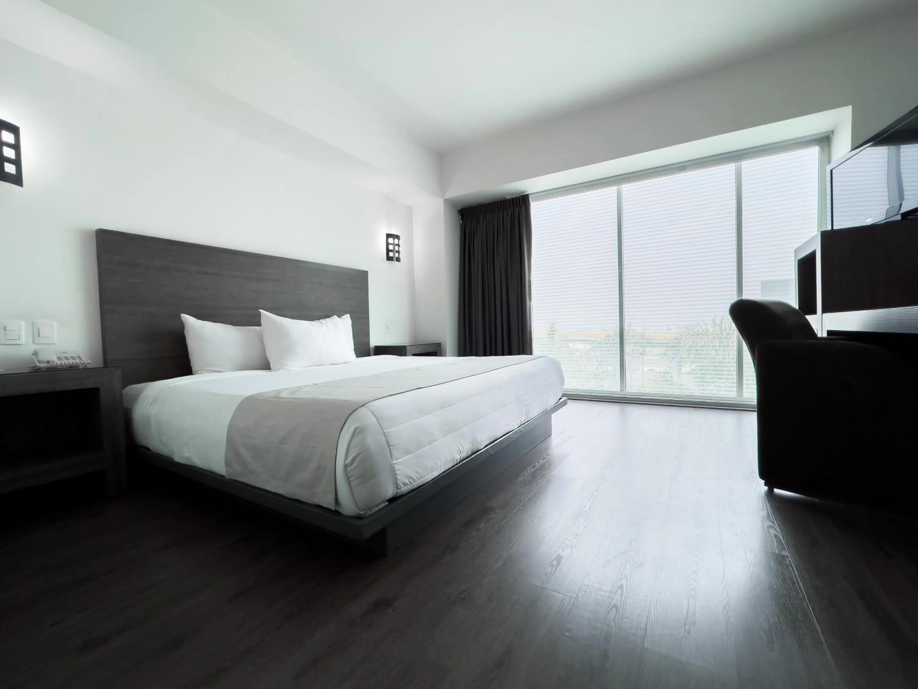 Bed in We Hotel Aeropuerto