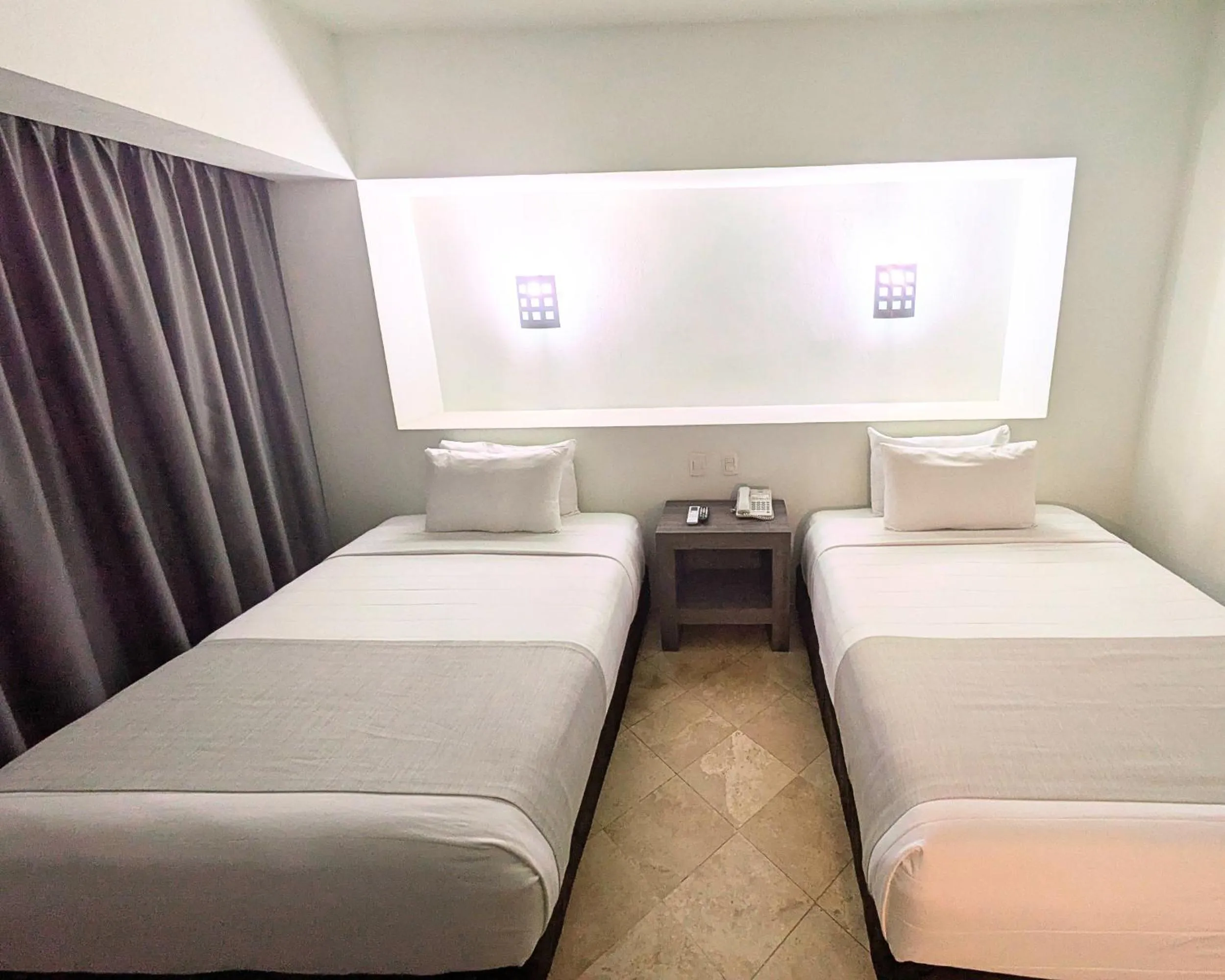 Bed in We Hotel Aeropuerto