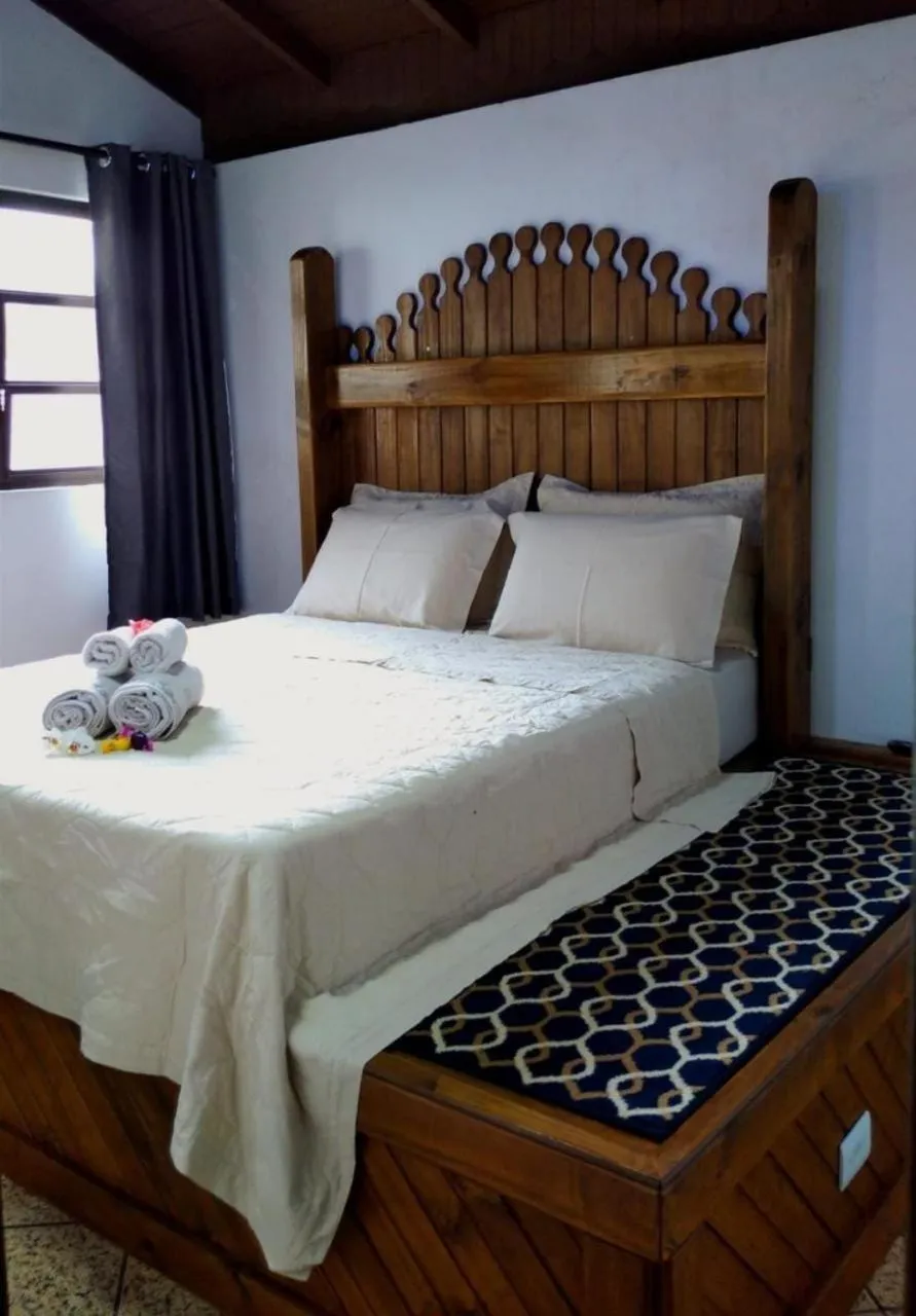 Bed in Pousada Casa do Oscar