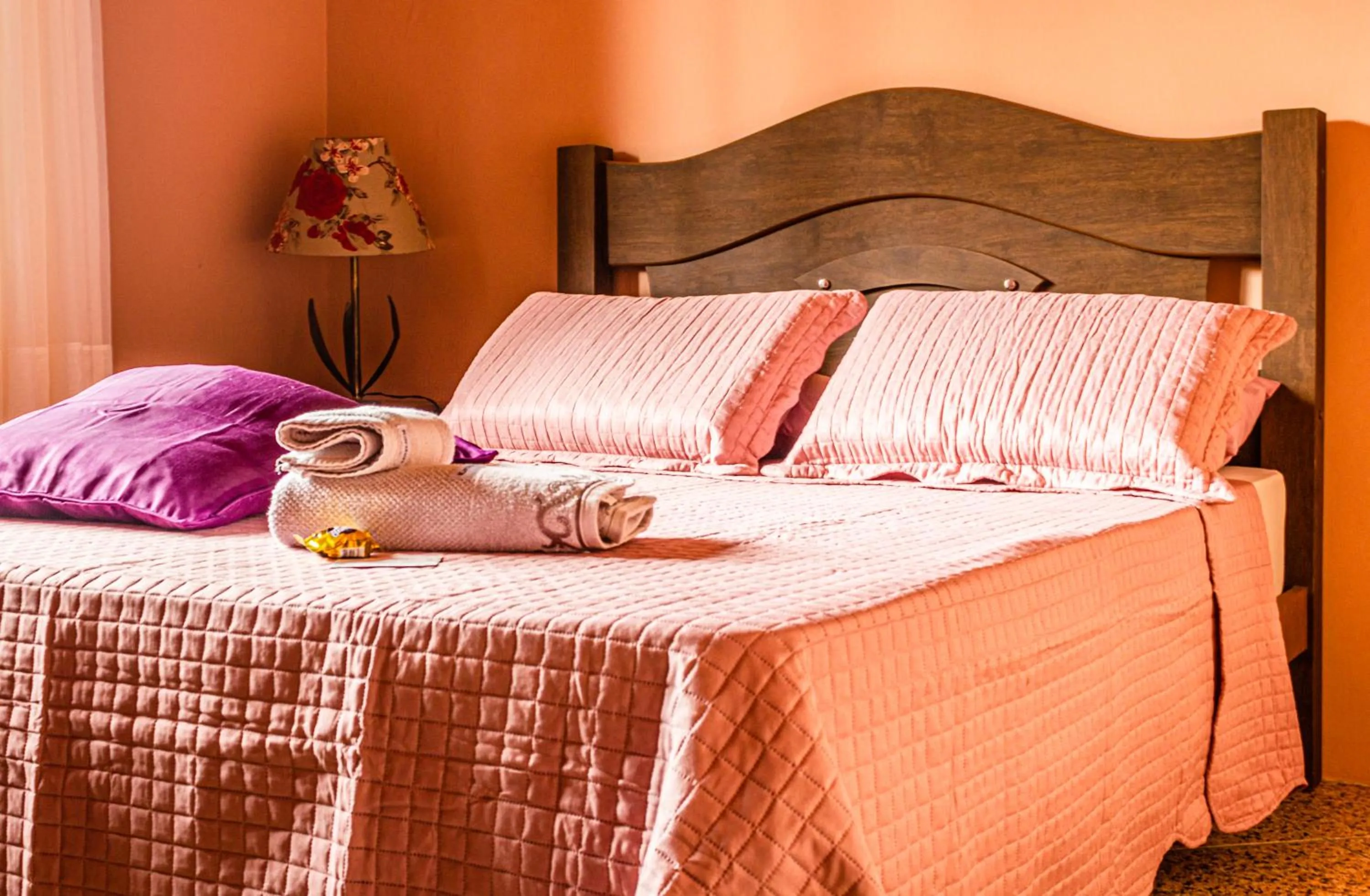 Bed in Pousada Casa do Oscar