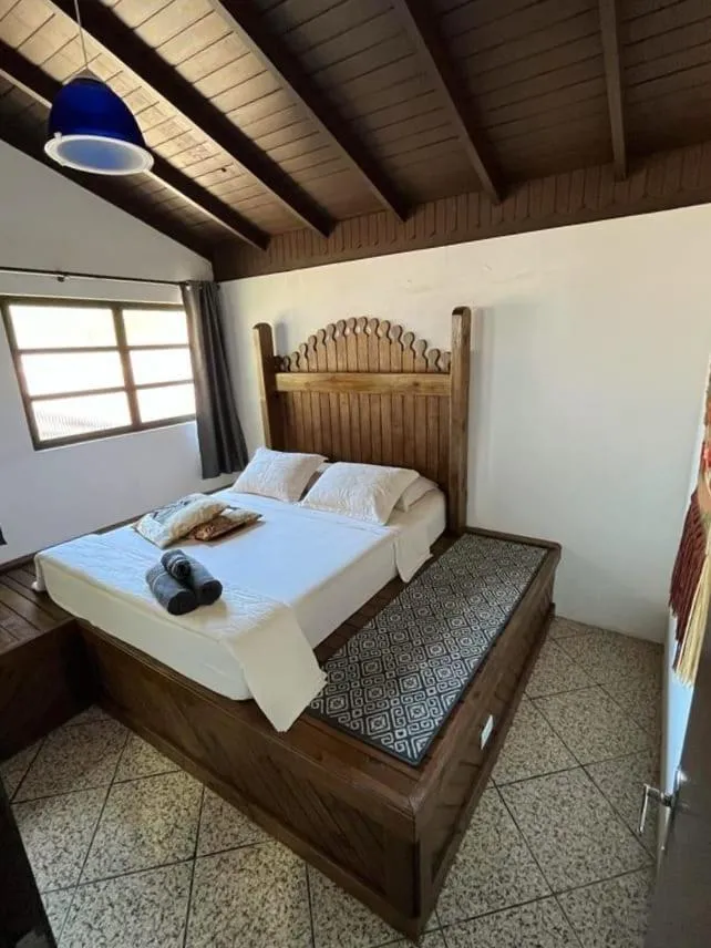 Property building, Bed in Pousada Casa do Oscar