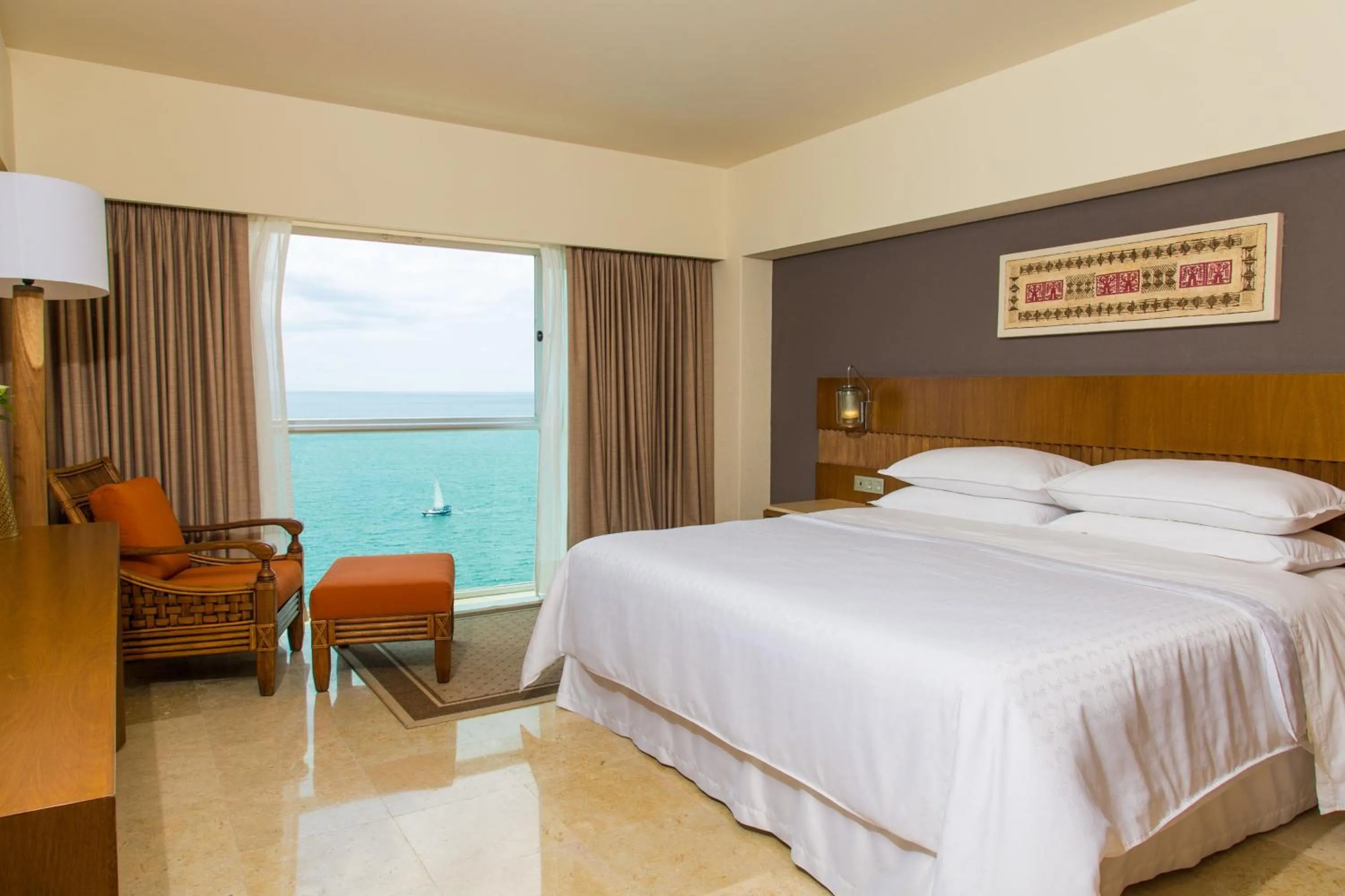 Photo of the whole room, Bed in Sheraton Buganvilias Resort & Convention Center