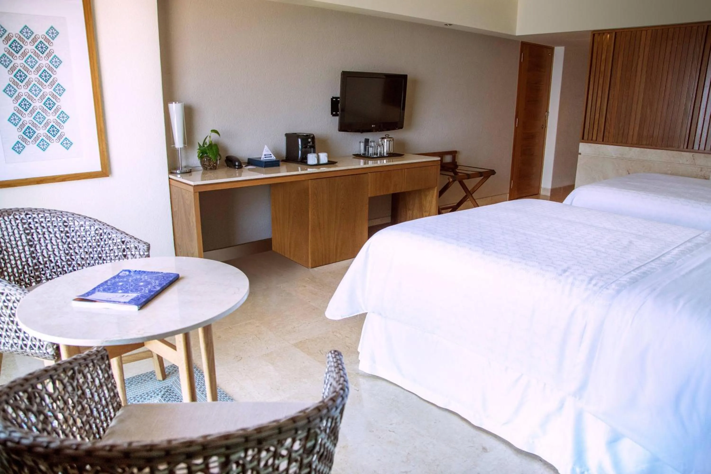 Photo of the whole room, Bed in Sheraton Buganvilias Resort & Convention Center