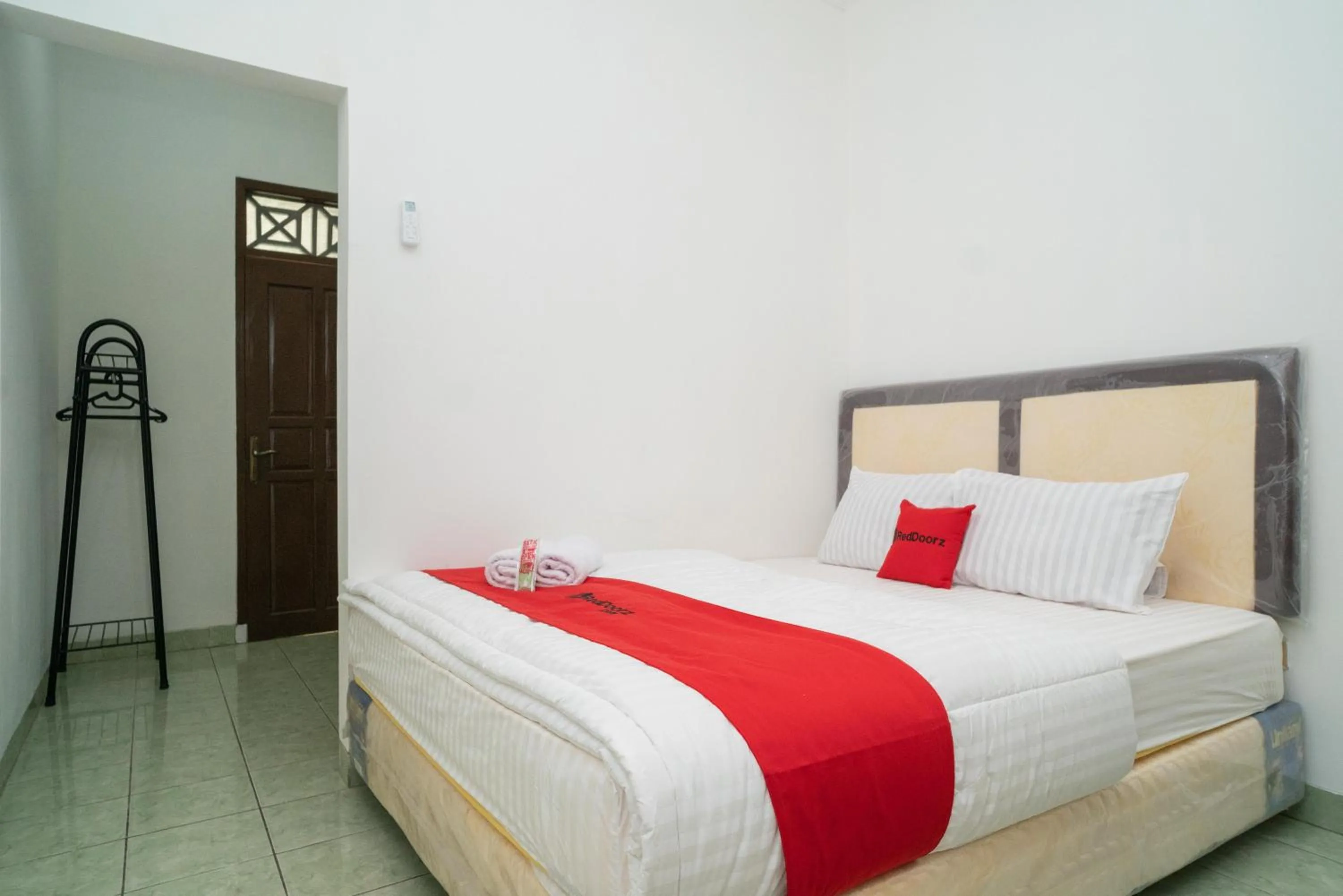 Bed in RedDoorz near Bundaran Ciceri