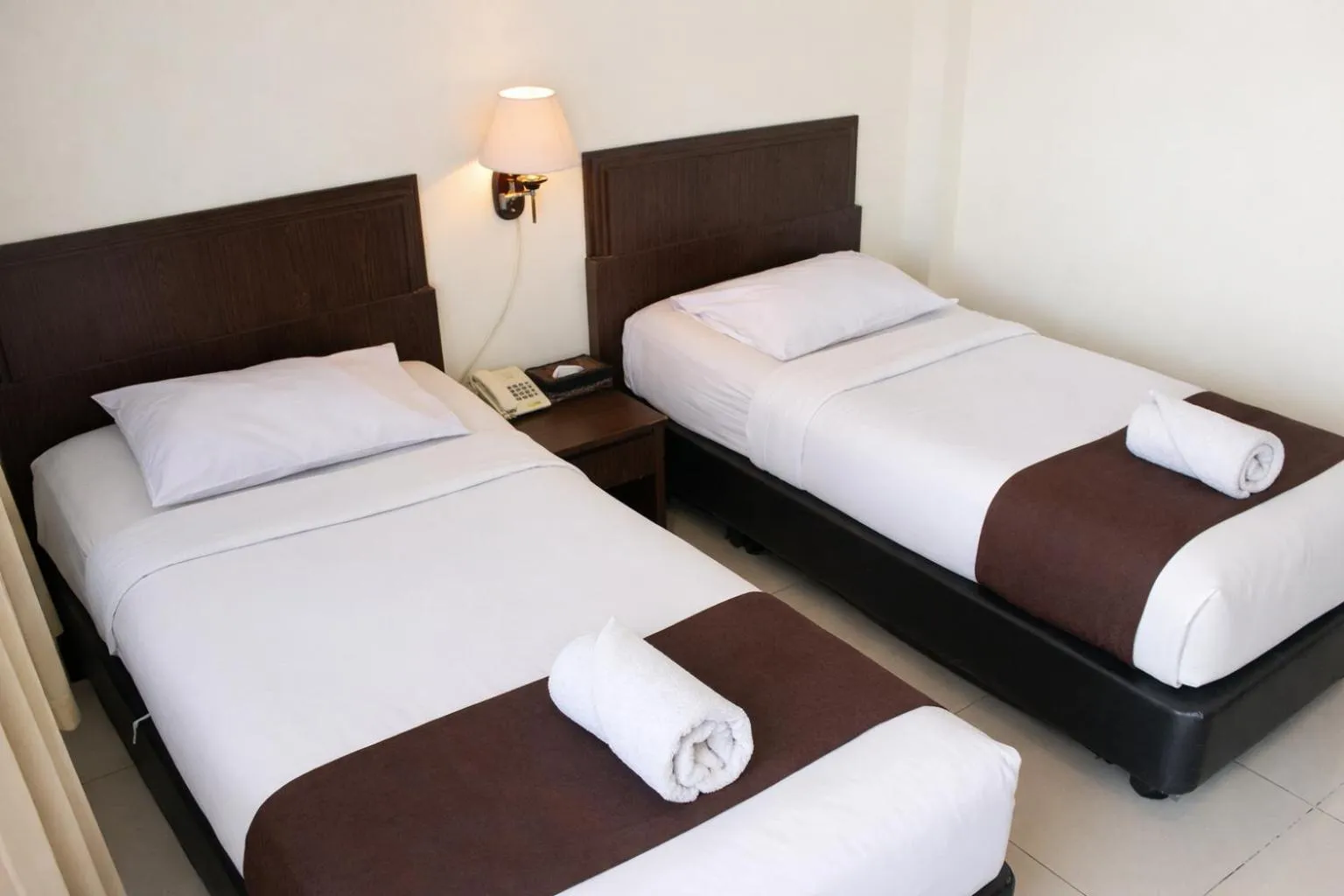 Bed in Manggar Indonesia Hotel