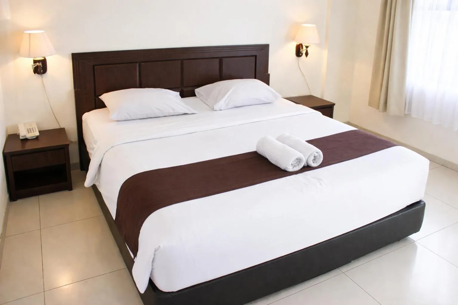 Bed in Manggar Indonesia Hotel