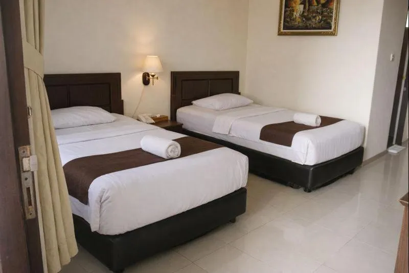 Bed in Manggar Indonesia Hotel