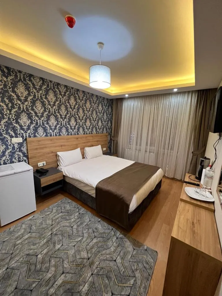 Bed in inDİANA HOTEL
