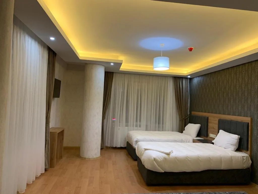 Bed in inDİANA HOTEL