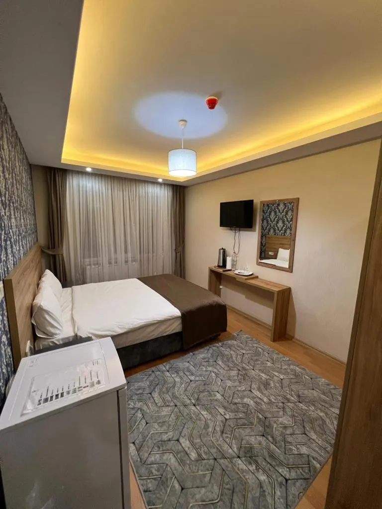 Bed in inDİANA HOTEL