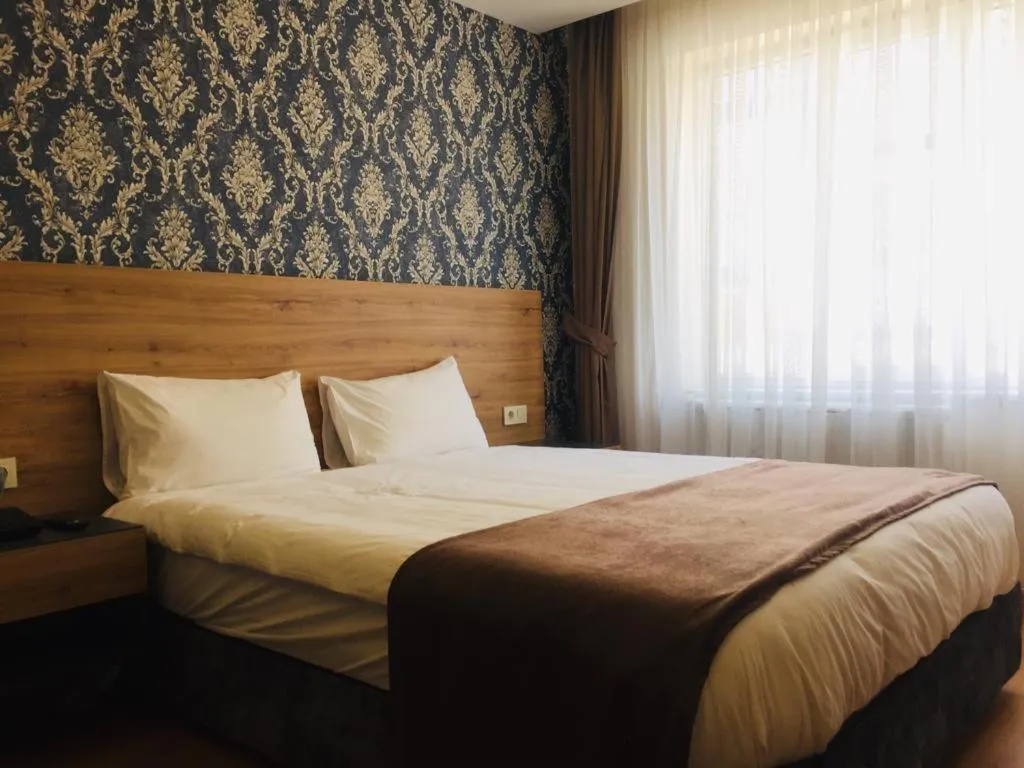 Bed in inDİANA HOTEL