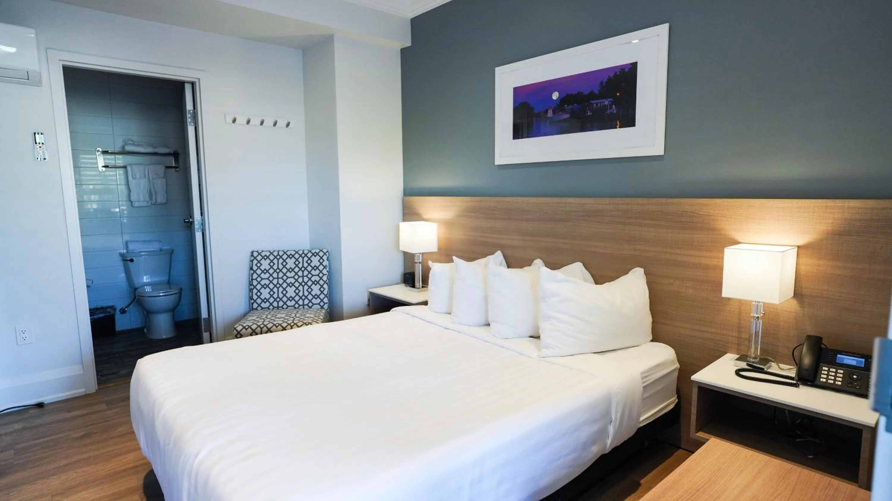 Bed in Colonial Hotel & Suites