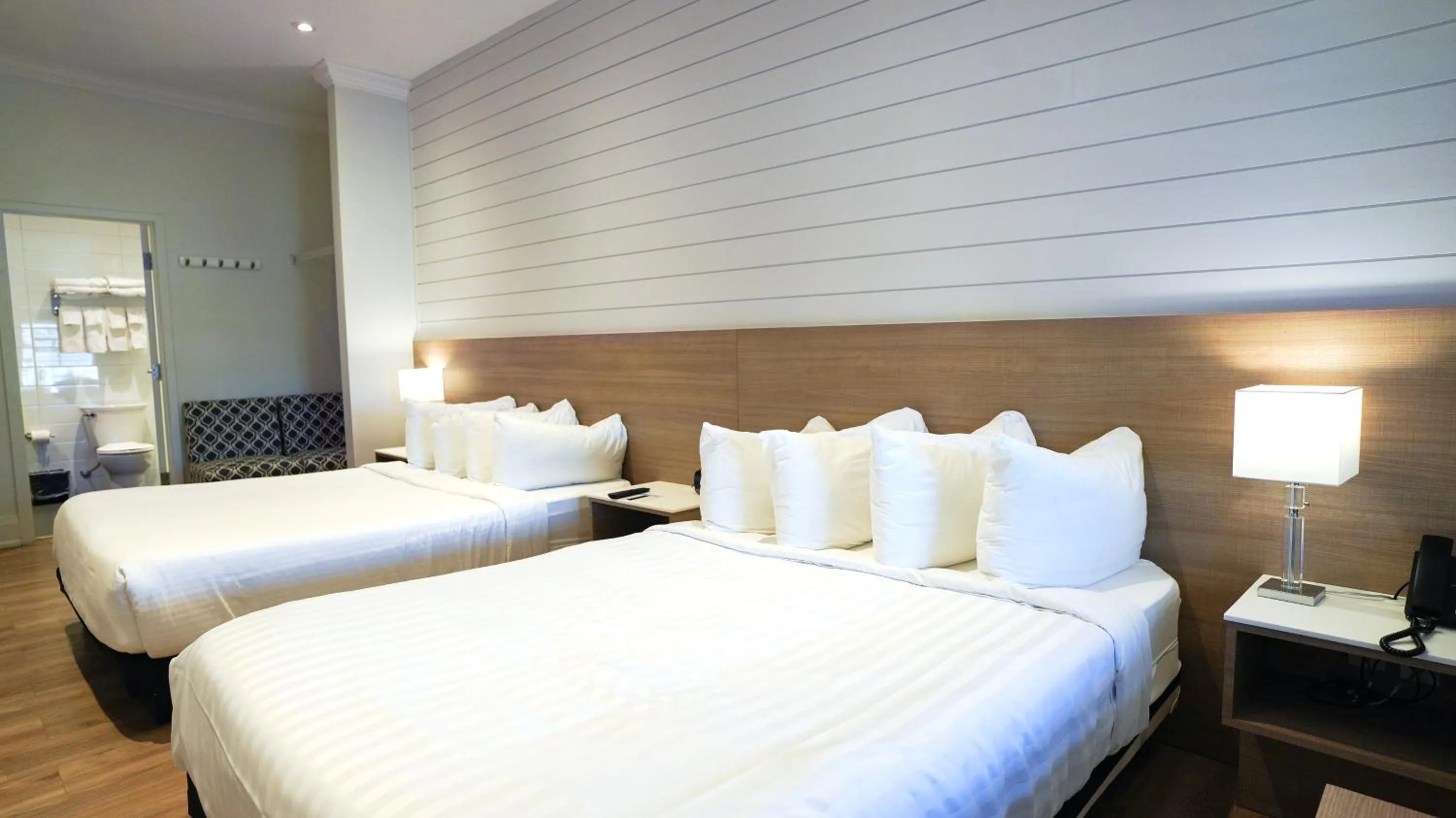 Bed in Colonial Hotel & Suites