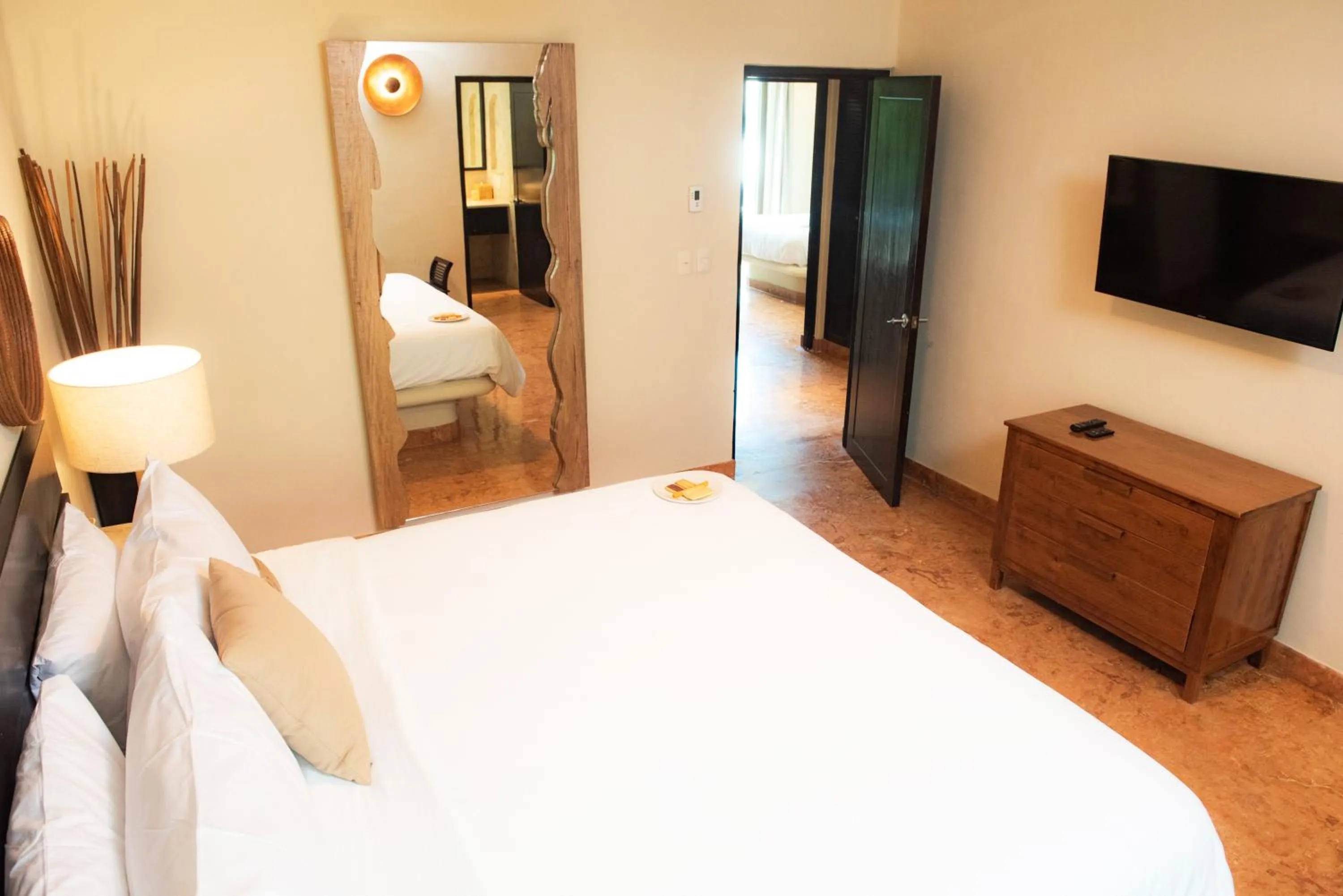 Bed in El Taj Oceanfront and Beachside Condo Hotel