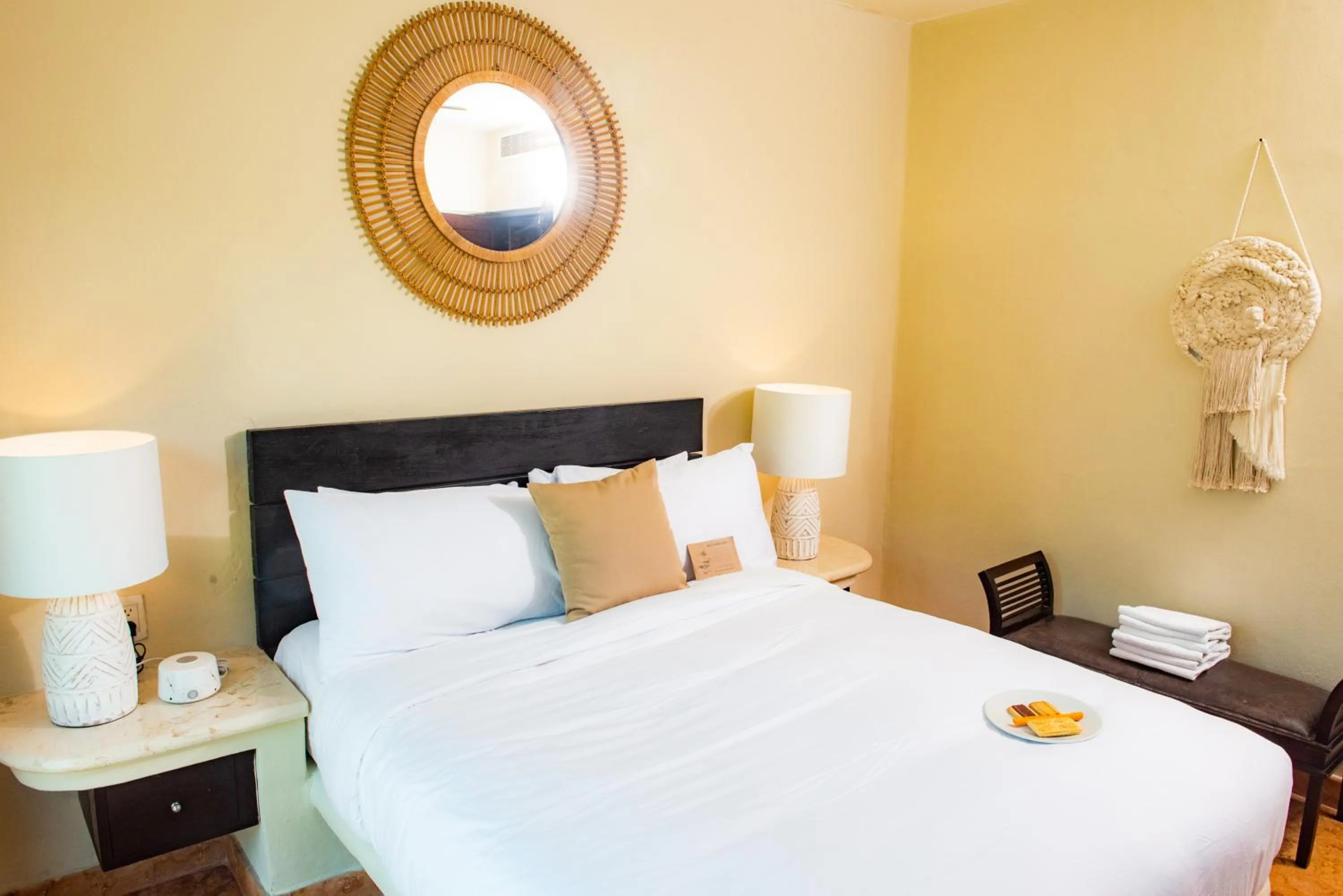 Bed in El Taj Oceanfront and Beachside Condo Hotel