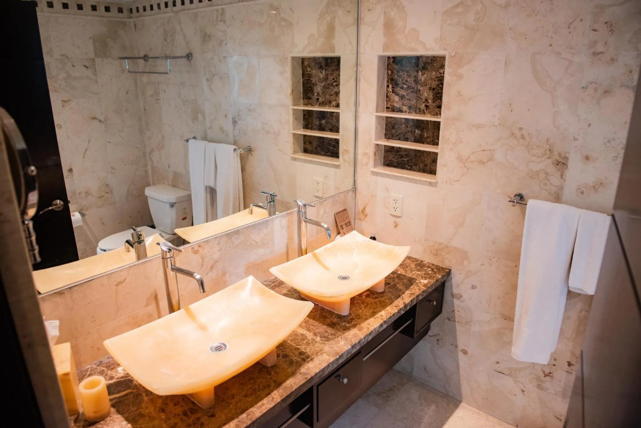 Toilet in El Taj Oceanfront and Beachside Condo Hotel