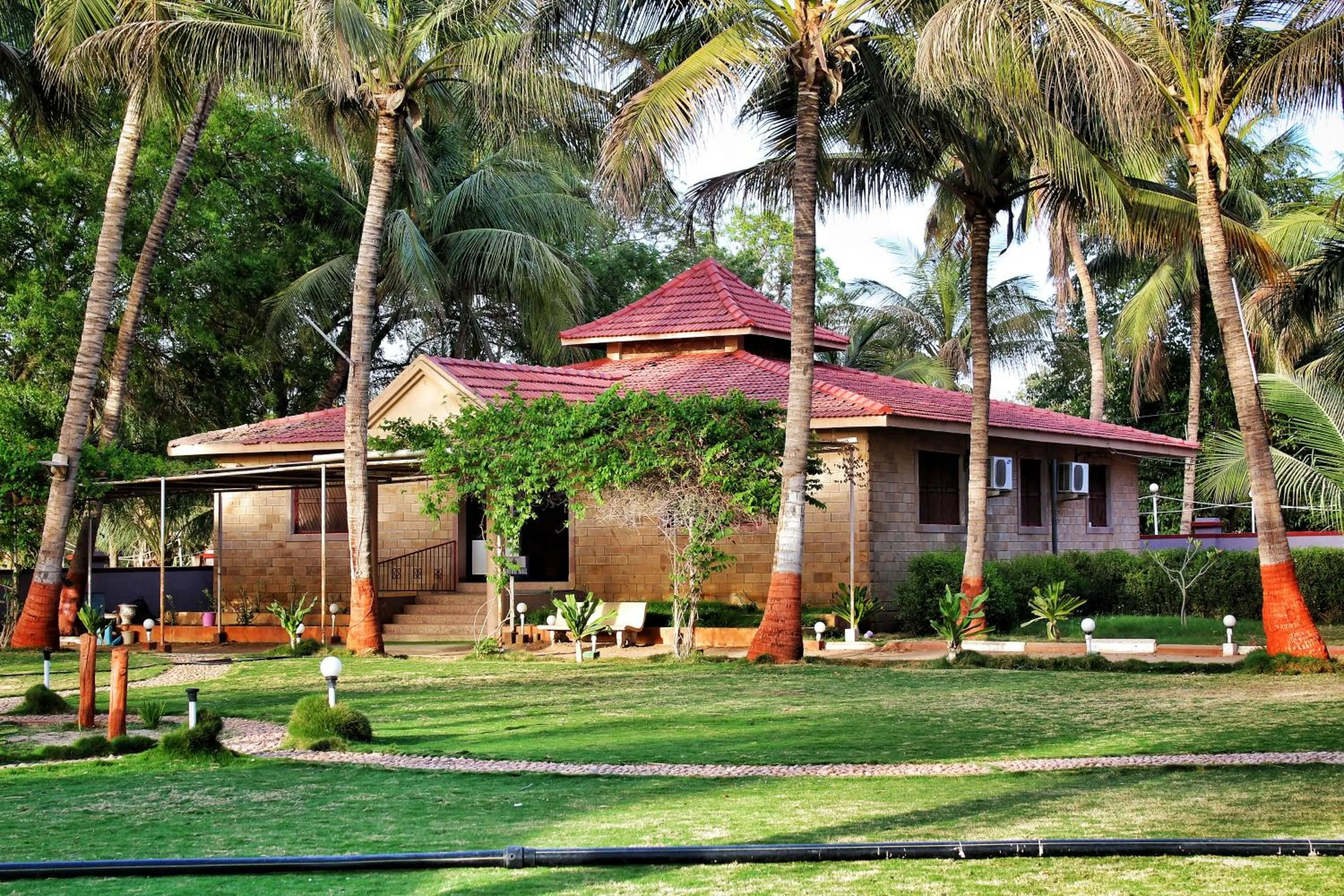 Property building in Stay Guru Resort Farm Villa