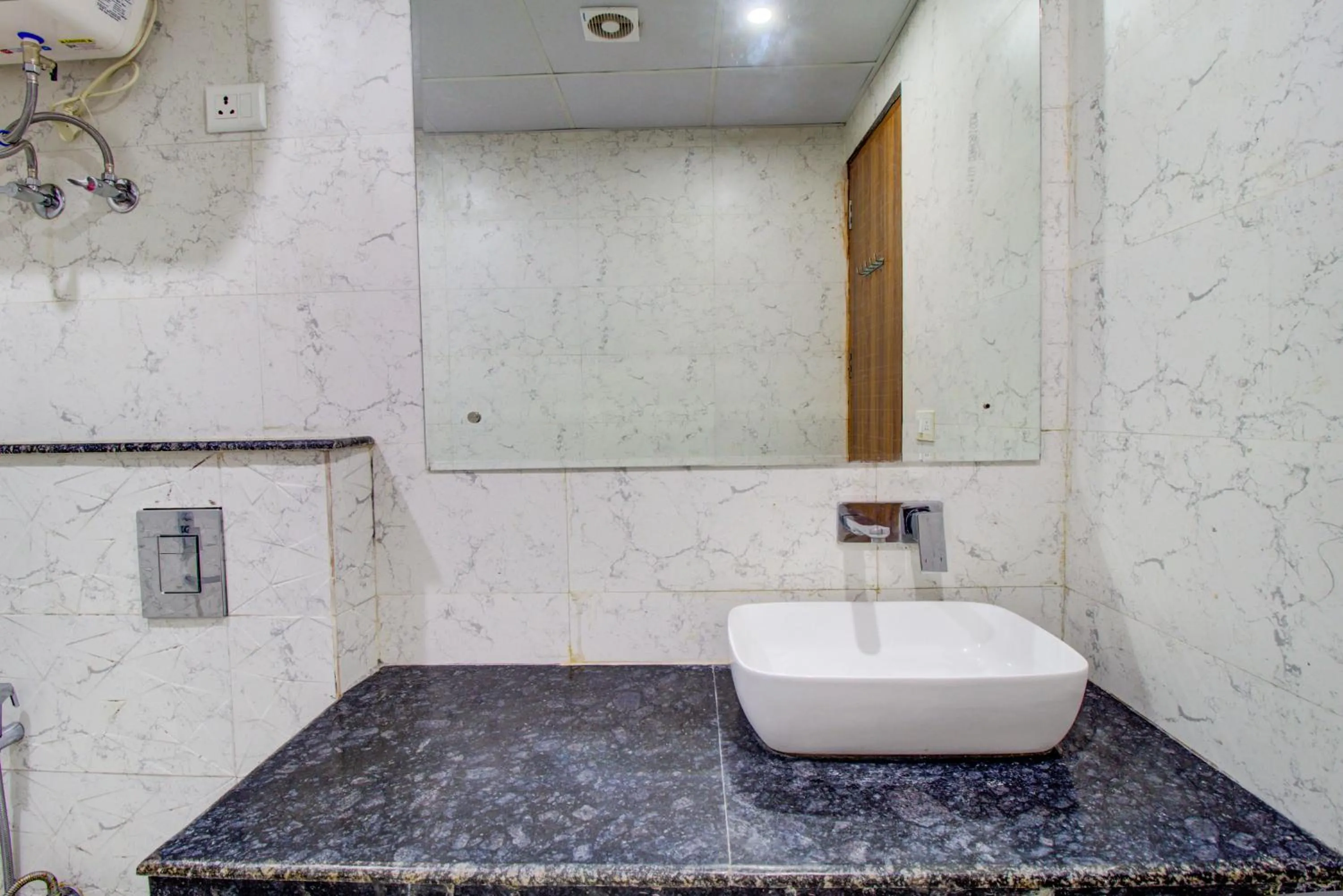 Bathroom in FabHotel Gross inn Suites - Nr IGI Airport New Delhi