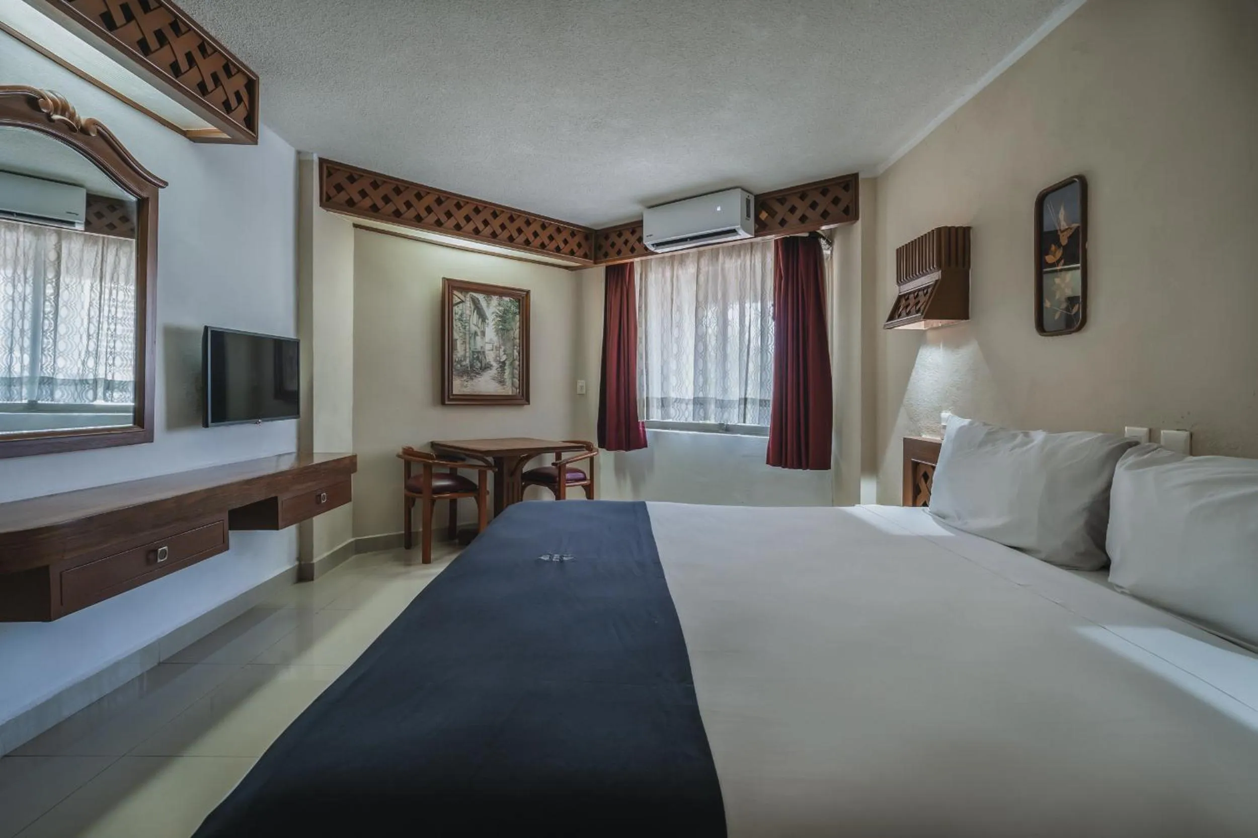 Bed in Hotel Plaza Kokai Cancún