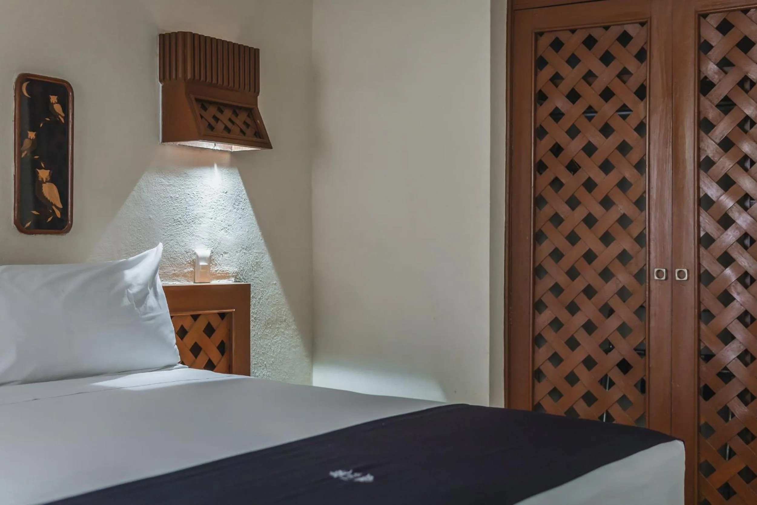 Bed in Hotel Plaza Kokai Cancún