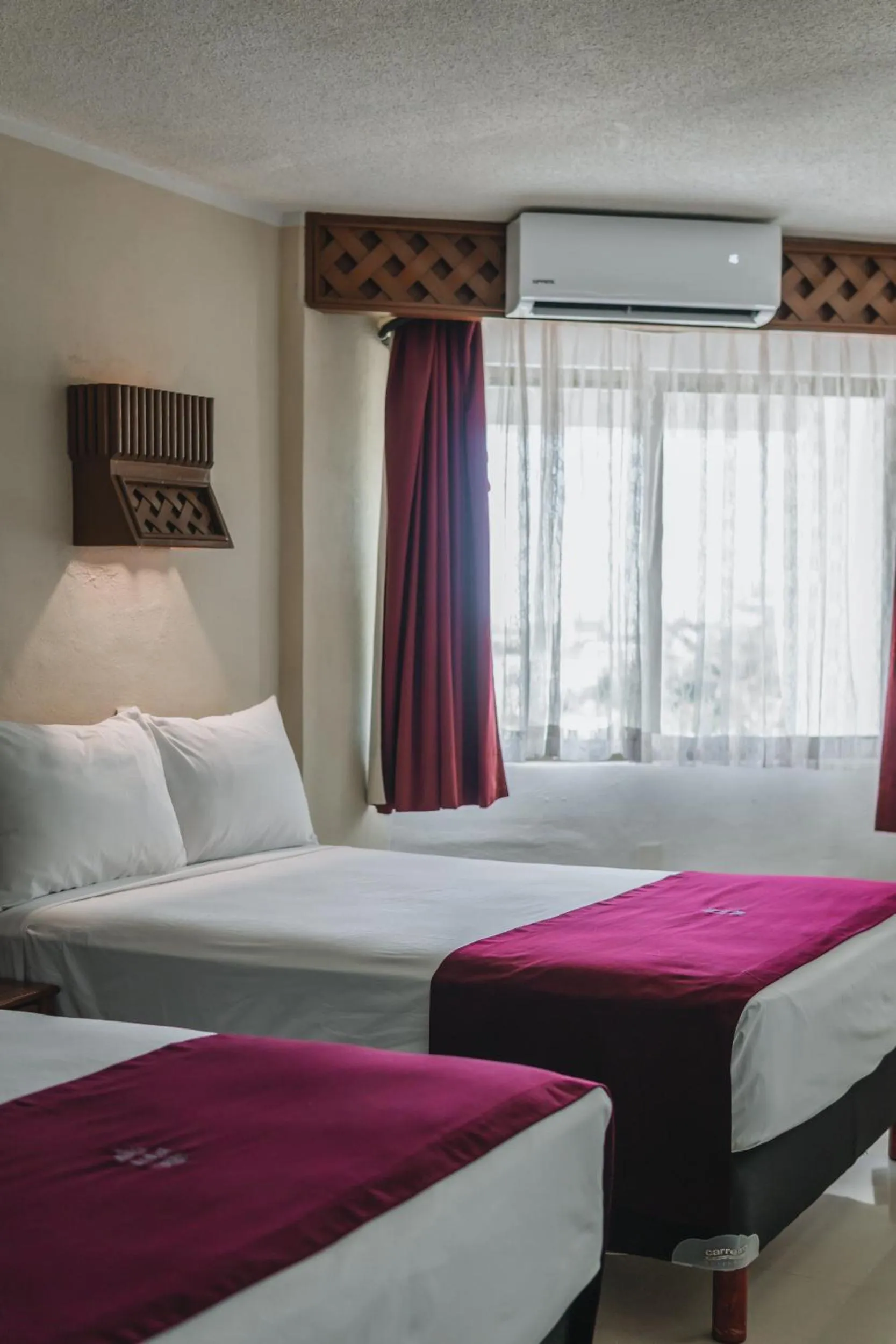 Bed in Hotel Plaza Kokai Cancún