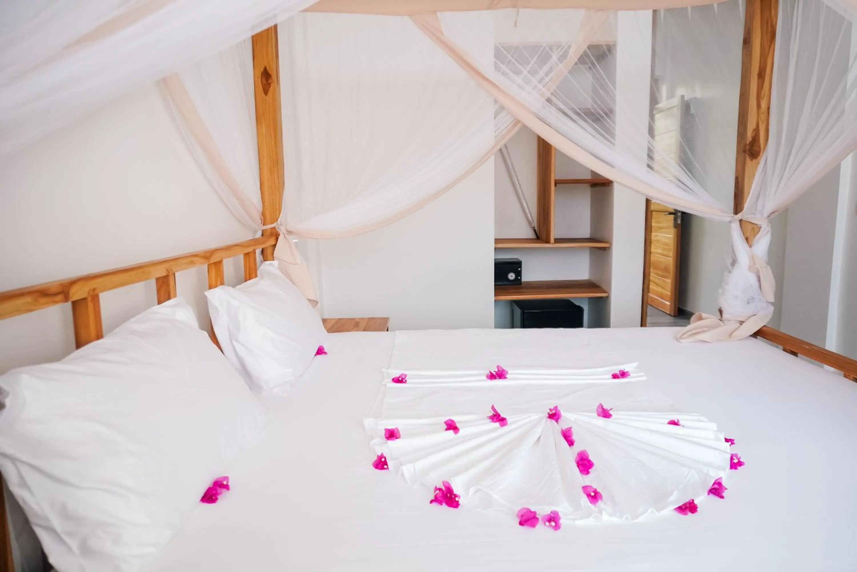 Bed in AHG Sun Bay Mlilile Beach Hotel