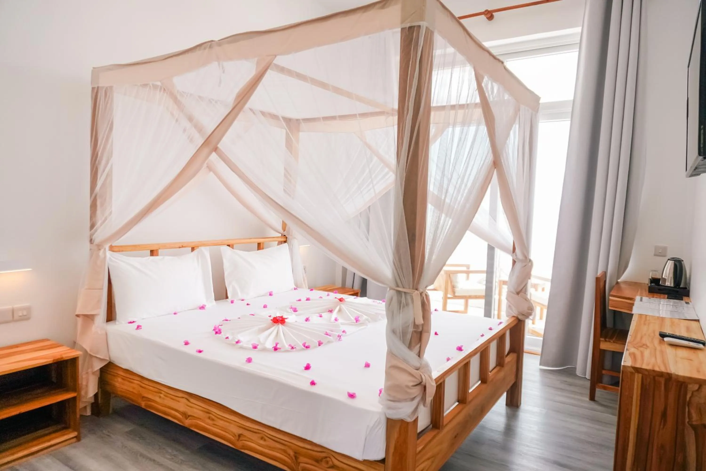 Bed in AHG Sun Bay Mlilile Beach Hotel