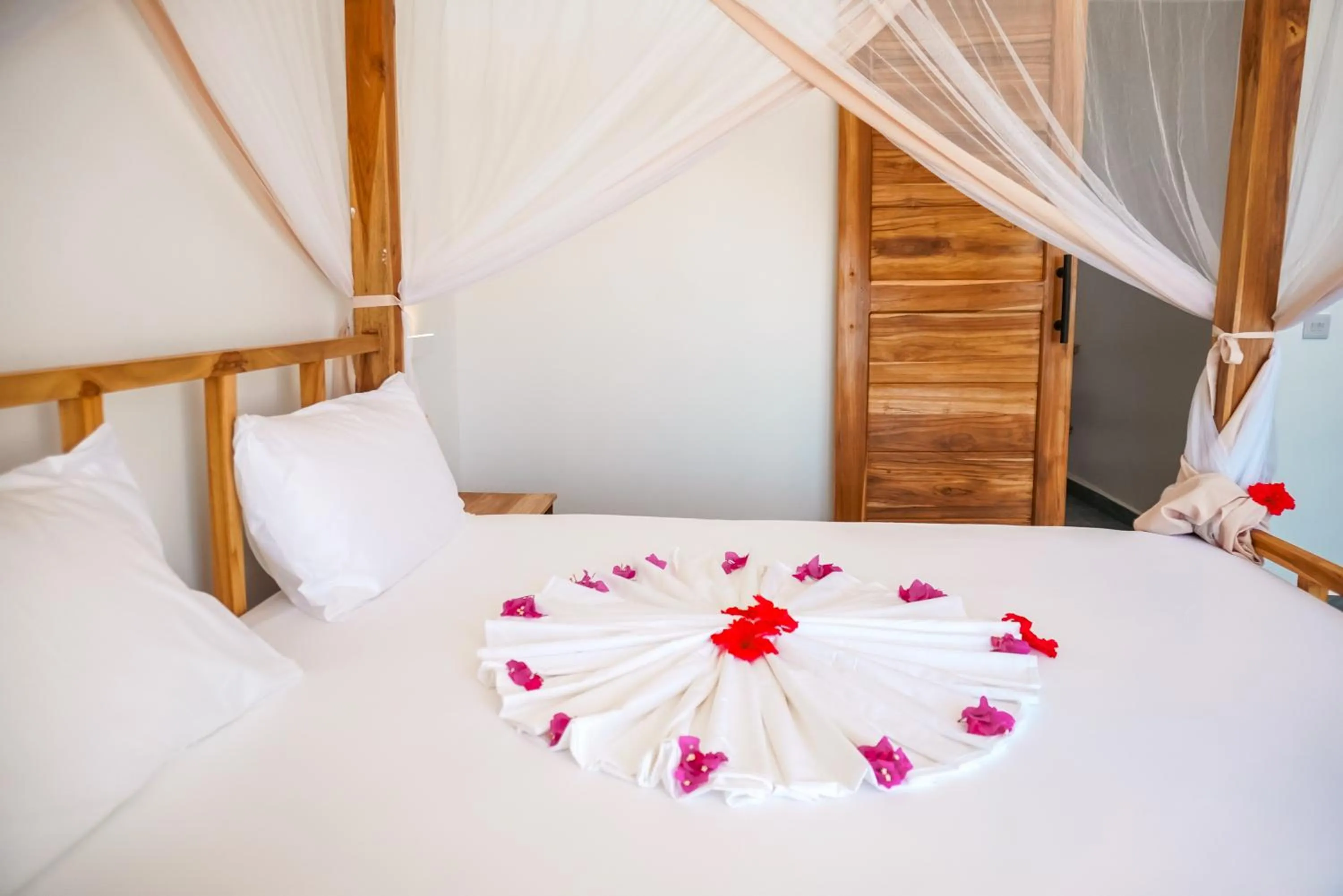 Bed in AHG Sun Bay Mlilile Beach Hotel