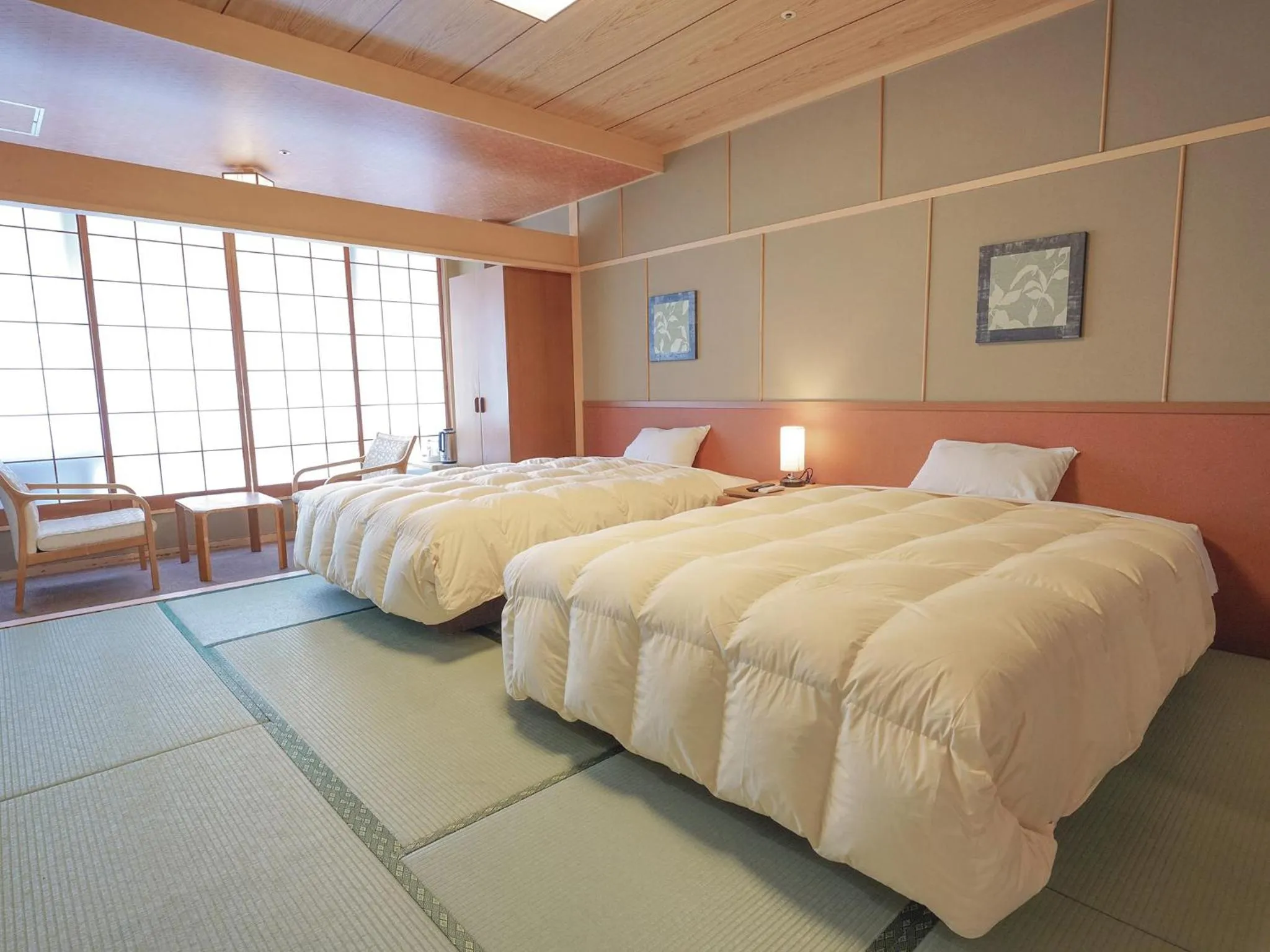 Bed in Yumoto Kanko Hotel Saikyo