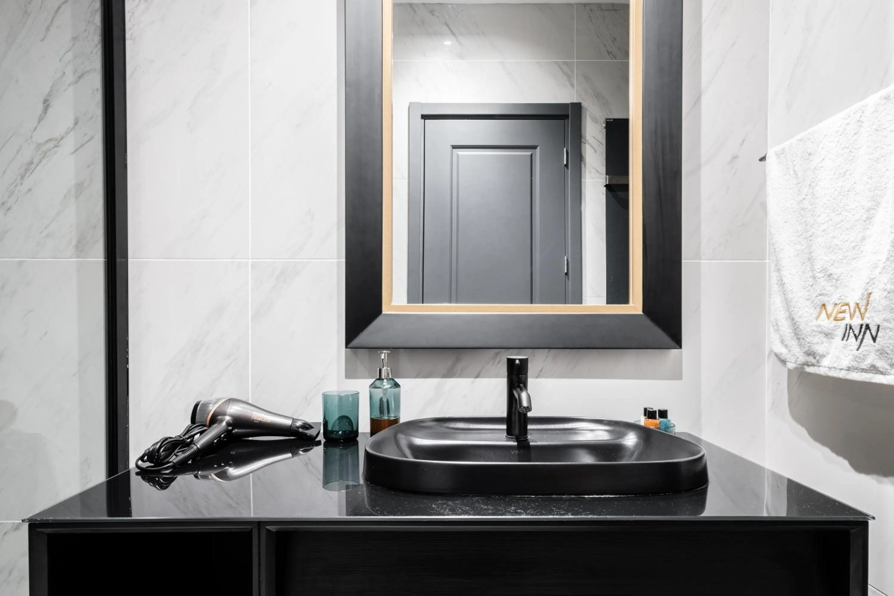 Bathroom in Benesta Residence by NewInn