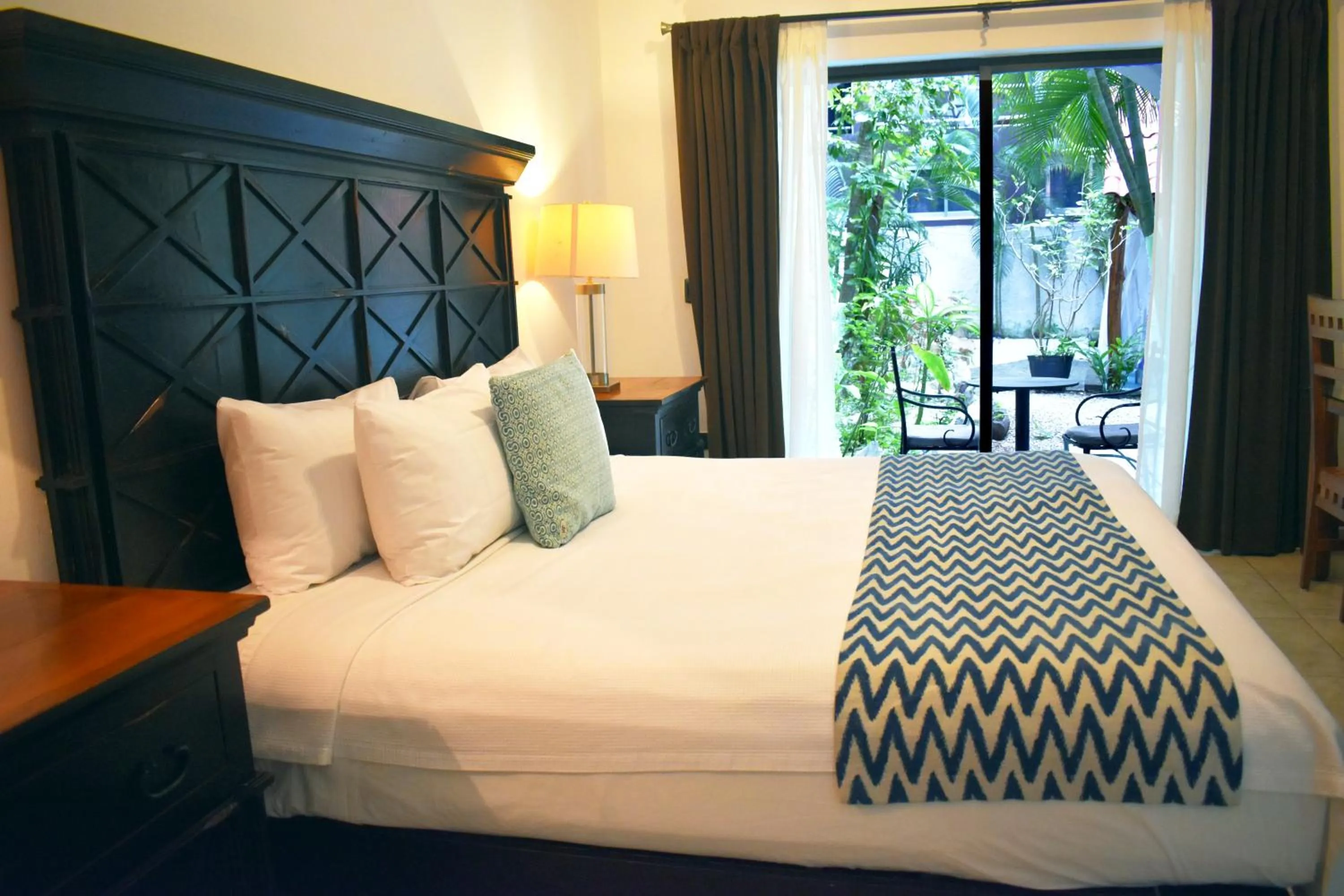 Bed in Hacienda Paradise Hotel